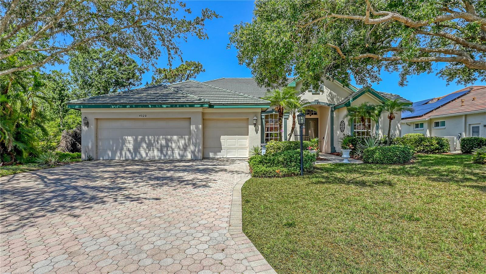 This beautiful custom built home set behind the gates of Treymore, in the Villages of Palm Aire, has been maintained by the original owners! As you enter this 3-bedroom, 3-bath, split plan home you are greeted by views of the tranquil lake. With multiple sets of sliding doors leading to an oversized covered lanai and private putting green. The spacious lanai is the perfect spot for entertaining or unwind and watch beautiful birds that frequent the lake. Light and bright with a huge aquarium window in the breakfast nook. The adjacent family room has a row of sliders which allow indoor and outdoor living spaces to seamlessly blend together. The master suite features a door to the lanai, large walk-in closet, dual sinks, a garden tub and walk-in shower. Additional features include a 3-car garage, crown molding, tray ceilings. Nearby Palm Aire Country Club offers 2- championship golf courses, tennis courts and pickleball. This ideal location is close to world class shopping & dining at the UTC mall, Whole Foods, I-75, Lakewood Ranch, a short drive to SRQ International Airport, Downtown Sarasota, and area the beaches.