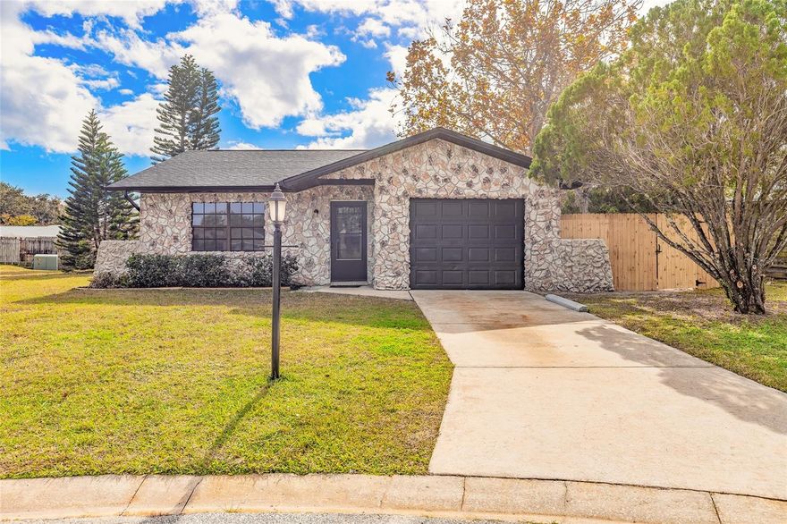 Welcome to this fully remodeled Port Orange gem, tucked away on a quiet dead-end street just minutes from the Intracoastal Waterway and offering short-term rental potential. Thoughtfully updated from top to bottom, this move-in-ready home features a new roof, new AC, and upgrades throughout. Step inside to discover low-maintenance vinyl flooring flowing seamlessly through the home, creating a bright and inviting atmosphere. The beautifully updated kitchen showcases crisp white shaker cabinetry, sleek granite countertops, and a classic tile backsplash, all centered around a sun-filled eat-in dining space. Sliding glass doors lead to a screened-in back porch, perfect for morning coffee, evening relaxation, or entertaining guests. An extended one-car garage provides added flexibility for storage, hobbies, or beach gear. With its prime location, thoughtful upgrades, and turn-key condition, this home checks every box. Don't miss your opportunity to own a beautifully updated Port Orange home, schedule your private showing today.