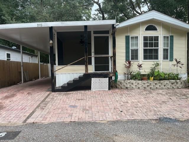 YOU OWN THE LAND This awesome 2 Bedroom, 2 Bath Manufactured home sits nestled amongst the mature Florida landscape and large trees. You can find it located in Jellystone Yogi Bear Park in Apopka near the 414. Included in your HOA Dues of $275.00 a month, water, trash pick up, and the use of numerous amenities such as 24 hour security gate, swimming pool, club house, putt putt golf, play ground and so much more. Don't miss this chance to own the land and the home. Freshly painted and new Luxury Vinyl flooring just installed. Call today for your showing