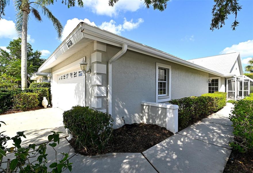 CLUB VILLAS IN PALM AIRE…Enjoy beautiful views of the golf course from this stylish 2 Bedroom plus Den villa just around the corner from the Palm Aire Country Club!  Enhanced by designer Carl March when this owner purchased, adding a wet bar and electric fireplace with mantel  Pretty entry with large window overlooking a garden atrium. Huge living room with cathedral ceilings, enclosed Florida room and dining area… great walls for art. Plantation shutters throughout the villa. The Florida room, living room and dining room all blend together to create a spacious area for any design to enhance the view. Entertaining is easy with this space and the "hidden" wet bar.  The kitchen has a breakfast area and opens to the screened lanai. You will love the owner's suite with double walk-in closets and large window. The master bath has a shower and a garden tub! Spacious 2nd bedroom, has a pocket door that opens to the guest bath. The den could easily be used as a 3rd bedroom with sleep sofa or Murphy bed. Freshly painted throughout. Great storage inside and in garage. AC system from 2016. Maintenance-free exterior and grounds gives you time to play golf, tennis and pickleball, swim and socialize at the club, many levels of memberships available. Membership is optional, not required, but a great way to socialize. Club Villas has a community pool and clubhouse too. Palm Aire is located close to Whole Foods, Fresh Market and Publix, plus all the great shopping and dining along the University Parkway corridor. A short drive to UTC Mall and Markets… Benderson Park and so much more. So convenient to downtown Sarasota.