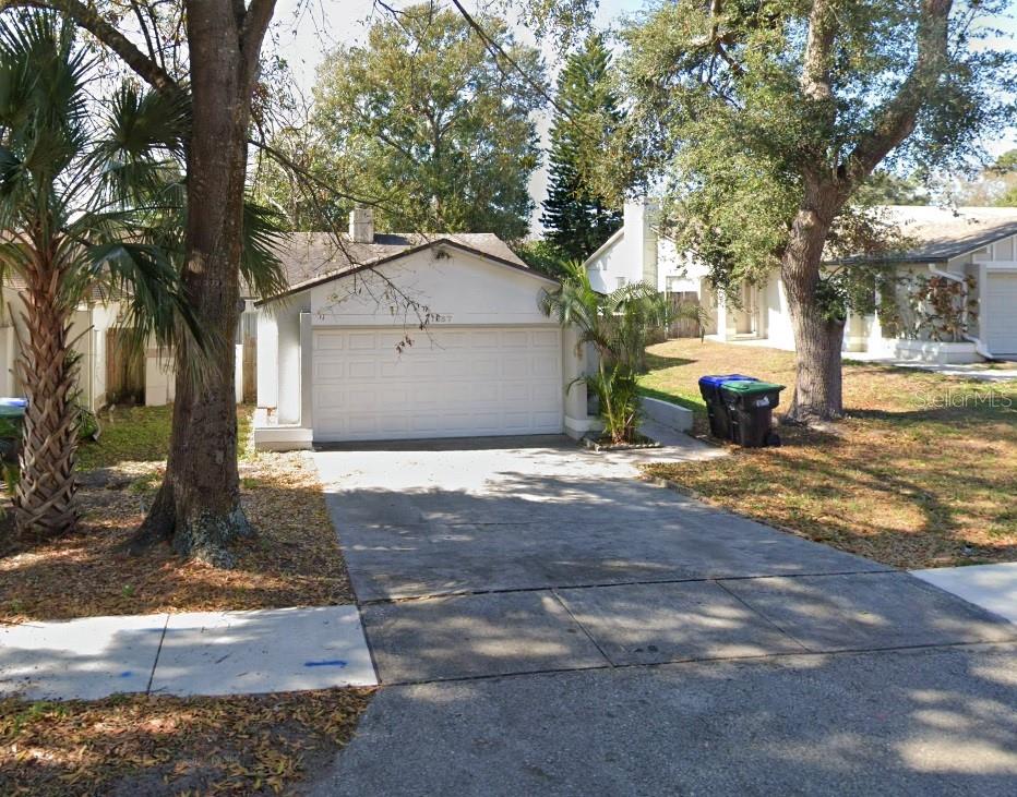 Calling all Investors!! This well-maintained 3-bedrooms, 2-bathrooms home features a cozy fireplace, spacious 2-car garage, and a fully enclosed lanai perfect for relaxing or entertaining. Enjoy easy-care flooring - no carpet anywhere! Don't miss this comfortable and move-in ready home.