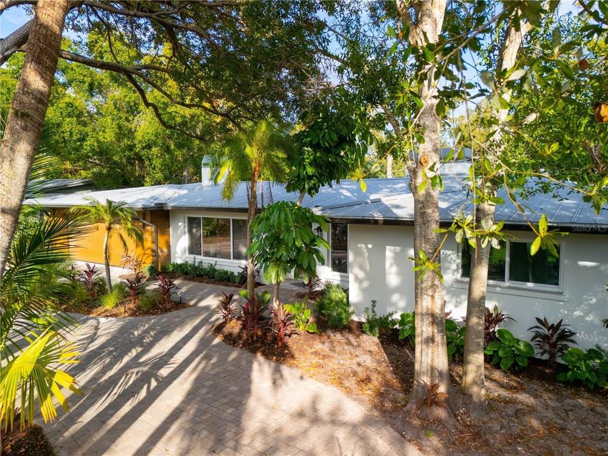 Experience elevated coastal living in this fully updated 4-bedroom, 3-bath home offering 2,529 sq. ft. of refined space in the coveted San Remo Estates community. *Interior photos will be up in a few weeks, property is ready for touring.* Just steps from the North Siesta Key Bridge, this residence combines a serene neighborhood setting with exceptional convenience to Sarasota’s top waterfront amenities.

Inside, an open-concept layout highlights a newly designed kitchen with modern appliances, a dedicated laundry room, and a versatile fourth bedroom perfect for an office, gym, or flex space. Custom closets throughout the home—crafted by Design Studio California Closets—enhance storage and organization, while thoughtful finishes create a warm, contemporary feel. A spacious 2-car garage adds everyday practicality.

Set on a generous 0.33-acre lot, the outdoor space is designed for entertaining and relaxation with a brand-new pool with champagne spa hot-tub, covered lanai, expansive patio, and outdoor bar area including a new full summer kitchen. Additional upgrades—new landscaping with irrigation, exterior lighting, a dog run, and a cozy fire pit—make this property an ideal retreat for enjoying Florida living at its finest.