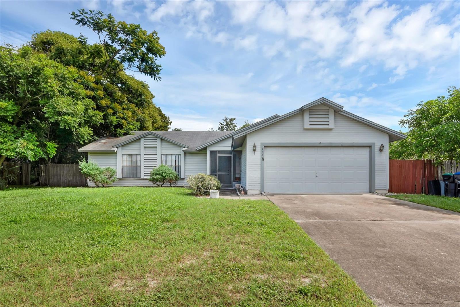 Opportunity knocks with this charming 3-bedroom, 2-bathroom home offering 1,373 sq ft of comfortable living. A spacious driveway and manicured front lawn welcome you home, while the fully fenced backyard provides peace of mind and the perfect space for little ones or four legged friends to roam freely. Step out onto the screened-in and covered rear patio, an inviting retreat where you can sip your morning coffee, enjoy weekend barbecues, or unwind in the evenings surrounded by the Florida breeze, all without the worry of pests. Inside, a functional split layout ensures privacy and comfort for everyone, with plenty of space to create a home that suits your lifestyle. Nestled in a prime location, you’ll have quick access to major highways for easy commuting, great schools nearby, and all the fun of Central Florida just minutes away; including Disney World, Universal Studios, downtown Orlando, and the airport all under 25 minutes. This home is the perfect blend of convenience, comfort, and Florida living. Don't miss out on the opportunity to make this home your own, schedule a private showing TODAY!!