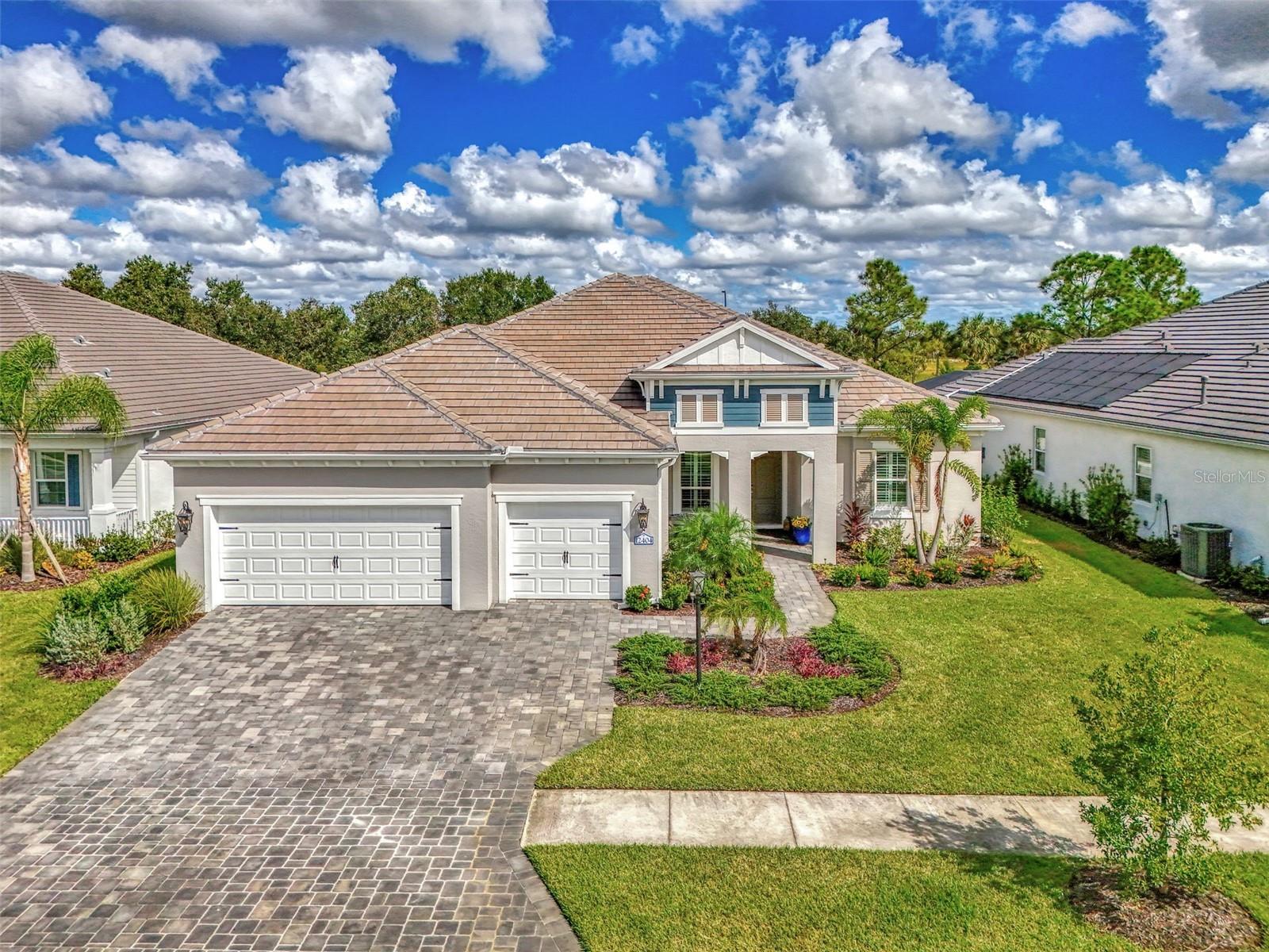 Welcome home to resort-style living in the highly desirable community of Grand Palm! Why wait to build when you can purchase this beautiful Savannah II home built in 2022 with all the upgrades and lighting already included! This Neal Communities’ home features HURRICANE IMPACT WINDOWS throughout with a heated salt-water pool and spa facing a preserve! Large open concept living space offers ample room for everyone. Three large bedrooms, three baths with a study/office, tech space and a large flex/bonus room. The Savannah II model features an elegant chef’s kitchen with a large island with quartz countertops, natural gas cooktop, tile backsplash, upgraded stainless steel appliance package with stainless hood and double oven. Eight-foot doors, walk-in pantry, crown molding, upgraded fans and lighting with plenty of storage space. Second bedroom offers privacy with an ensuite and walk-in closet. Enjoy tile throughout the main living areas and luscious carpet in the bedrooms. Spacious owner’s suite boasts a beautiful pool view and is equipped with dual walk-in closets. Dual vanities, custom tile, walk-in shower, large soaking tub and quartz countertops throughout. Enjoy additional living space in the flex/bonus room that opens up to the large lanai. This home is complete with a three-car garage and epoxy floors. For those quiet evenings on the lanai, enjoy your outdoor kitchen with grill, sink, counter and refrigerator then enjoy swimming in the beautiful pool or relaxing in the spa! Grand Palm is an amenity rich community with a surplus of activities to keep you busy day in and day out. A full-time activity coordinator has a monthly events calendar, 3 community pools, tennis, pickleball, full fitness center with classes, and 28+ miles of walking and biking trails are available for your pleasure. Grand Palm is located close to numerous beaches, downtown Venice, Wellen Park, and major airports. Living the life you’ve earned can be more than just a dream and this property offers a combination of luxury, comfort, and stunning surroundings, making it a truly special place to call home.