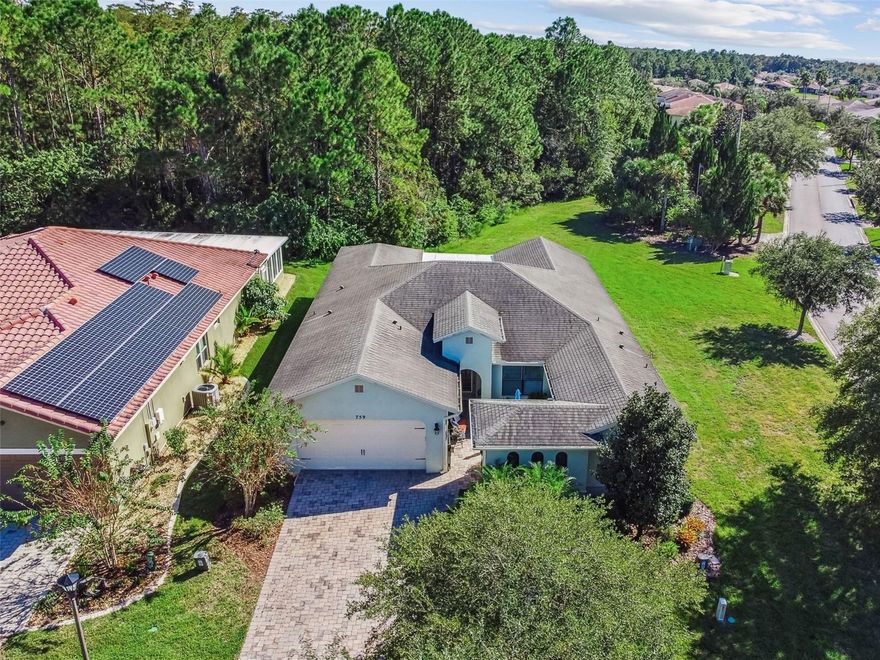 Located near The Palms Resort Amenity Center, this beautifully appointed Naples Model (2.956 Sq Ft) offers the perfect blend of comfort, style, and functionality. Designed for both everyday living and effortless entertaining, this spacious home sits on a premium corner lot with tranquil conservation views. Step into the private courtyard, an inviting outdoor retreat ideal for relaxing or gardening. Enter through the leaded glass front door into a bright and open living space featuring 18-inch ceramic tile floors throughout the main areas, custom illusion blinds, and a vaulted ceiling with a Minka ceiling fan. The Great Room, framed by custom drapes and conservation views, flows seamlessly into the Dining Room, where you’ll find an elegant chandelier, crown molding, and tailored window treatments. The living area extends into the enclosed 4-season room with a conservation view adding versatile space for year-round enjoyment. The chef’s kitchen is both stylish and functional, offering: A breakfast nook and island/bar with pendant and recessed lighting, Stainless steel appliances, including a 2024 LG 4-door Smart Refrigerator with extended warranty, Tile backsplash & under-cabinet lighting, 24 full-extension pull-out drawers, deep double sink with upgraded faucet, and Large walk-in pantry plus Butler’s pantry. The Primary Suite is an oversized retreat with luxury vinyl plank flooring, an expansive (WOW) customized walk-in closet with drawers, bench seating, and overhead storage. The en-suite bath features a walk-in shower with seat, dual sinks, wall-to-wall cabinetry with pull-outs, and custom lighting. On the opposite side of the home, the Guest Suite offers privacy with its own flexible office/sitting area with built-in shelving and a private bath featuring a walk-in shower, upgraded fixtures, and custom cabinetry with pull-outs drawers. Additional upgrades include: "Easy on the back" full extension pull-out drawers throughout the kitchen and both bathrooms. A Laundry room with custom cabinets and sink. 2-car garage with epoxy flooring, built-in shelving,  overhead storage and an extra refrigerator.  Also, a much desired separate golf cart garage. This exceptional home is a quick close, move-in ready and offers the ideal combination of thoughtful upgrades, spacious design, and a highly desirable location close to Solivita’s resort-style amenities.  Solivita offers residents access to state of the art amenities and work out facilities, dance and aerobics studios, a business center, 14 heated swimming pools, 2 heated spas, tennis courts, pickleball courts, shuffleboard, bocce ball, billiards room, art gallery, 3 restaurants and 2 championship 18-hole golf courses, driving range and putting course. Every day offers something new to explore and enjoy! This home also features easy access to nearby shops,as well as a brand new shopping center that caters to all your needs (including Sprouts) dining, and health care, offering the perfect balance of privacy and lifestyle.