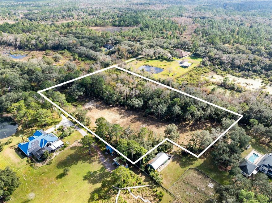 Exceptional opportunity to purchase a fully prepared 5-acre parcel with major improvements already completed, significantly reducing build time and upfront costs. Approximately two acres have been cleared, offering a balanced mix of usable land and privacy.

The property includes an asphalt millings driveway, a retention pond, and a 10,000 sq ft main house pad professionally built with additional fill to sit five feet above the roadway crown of Murphy Street. A second elevated pad has also been constructed for an outbuilding, workshop, or secondary structure, with fill bringing it three and a half feet above the roadway crown.

Septic tank and drain field permits have been approved, impact fees have been paid, and building plans and permits are already in place. The notice of commencement has also been approved, making this property truly shovel-ready for immediate construction. 

With critical infrastructure, permits, and approvals already completed, this property presents a rare opportunity for a buyer looking to build without delays. Bring your builder and start immediately.