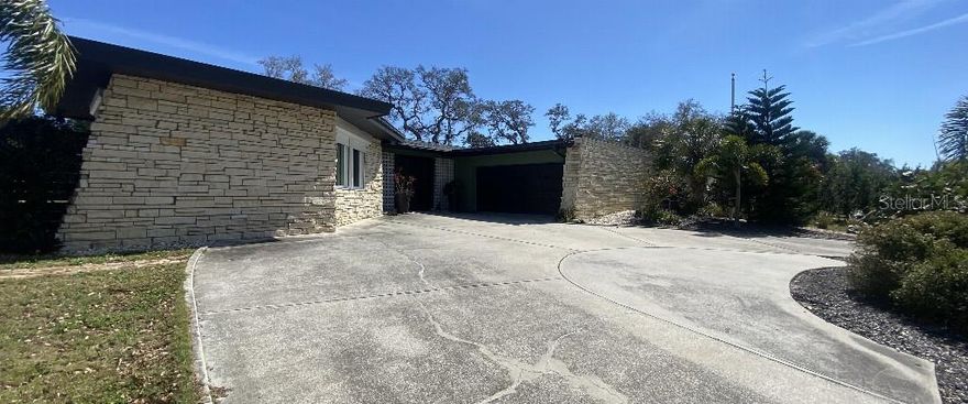 Located in one of the area’s most sought-after neighborhoods of Harbor Bluffs, this updated 3-bedroom, 2-bathroom home is adjacent to beach, Intracoastal Waterway, public boat ramp, parks, shopping, and dining. The property sits outside of any flood zone. NO FLOOD Insurance required, NO EVAC Zone, and a low $405/year HOA. A Sabala-built inspired Mid-Century Modern home in the Harbor Bluffs community. RECENT UPGRADES: NEW ELECTRIC PANEL, NEW IMPACT WINDOWS IN FRONT, NEW POOL EQUIPMENT 2023, NEW ROOF by Arry’s Roofing (2022), NEW HVAC and MINISPLITS (2020-2021), total interior and exterior fresh paint, and NEW KITCHEN CABINETS AND COUNTERTOPS.  24" Dishwasher space ready with electric and plumbing. Priced for you to make any improvements you would like. Open-concept living area. A spacious kitchen island and stainless steel appliances. 32' x 15' pool for relaxing with safety fencing. This property offers three bedrooms and a bonus room with exterior entry, ideal for a home office, fourth bedroom, or creative space.  Split-bedroom layout, ample storage and a large pantry wall. Oversized, 2 car garage.