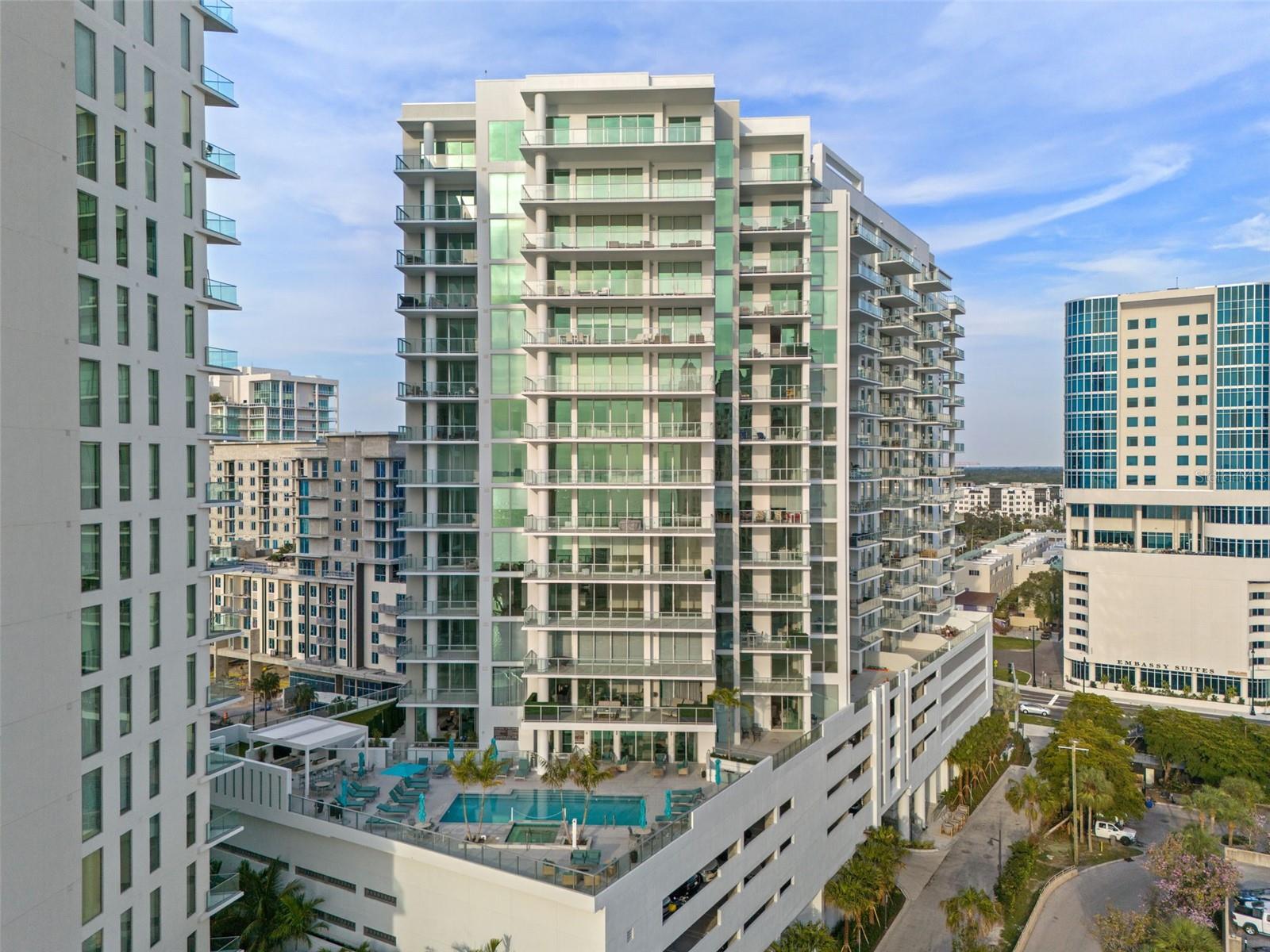 DISCOVER luxury seasonal living at BAYSO, 301 Quay Commons #710, where sophistication meets Sarasota’s vibrant waterfront lifestyle. This fully furnished end-unit residence offers 2,185 sq. ft. of elegantly designed living space, plus a private 185 sq. ft. terrace with unobstructed west-facing views of Sarasota Bay and unforgettable sunsets. FLOOR-to-ceiling windows and soaring 10-foot ceilings create a light-filled retreat unlike any other. BOTH bedrooms are ensuite, with the primary suite featuring a spa-inspired bath with an inviting soaking tub, walk-in shower, and generous closet space. The versatile Den functions as a third bedroom, complete with closet, and wood shelving. A unique angled floor plan enhances the spaciousness while offering distinctive character. BAYSO pampers its residents with resort-caliber amenities located on two levels. The fifth level offers a beautiful view of Sarasota Bay. This is where you will find a saltwater pool and spa, fire pit, and two outdoor gas grills perfect for entertaining. The Splash Lounge provides an air-conditioned gathering space with catering kitchen and water views, ideal for relaxing or hosting. ON the first level there is a Club Room with floor-to-ceiling glass that is perfect for hosting parties. It also has a kitchen island, t.v. fireplace and comfortable seating. There is also a catering kitchen that is accessed from the hallway to ensure a discreet area for catering your event. THE Quay Sarasota location places you near fine dining at Ocean Prime, the waterfront at Marina Jack’s, and just minutes from Downtown Sarasota’s cultural scene. The Bay Park’s 53 acres of green space and Lido Beach’s powdery sands are within easy reach, offering the best of Sarasota’s coastal lifestyle. AVAILABLE at $9,500 monthly, this luxury residence offers a rare opportunity to indulge in the seasonal Sarasota lifestyle you deserve. Schedule your private showing today.