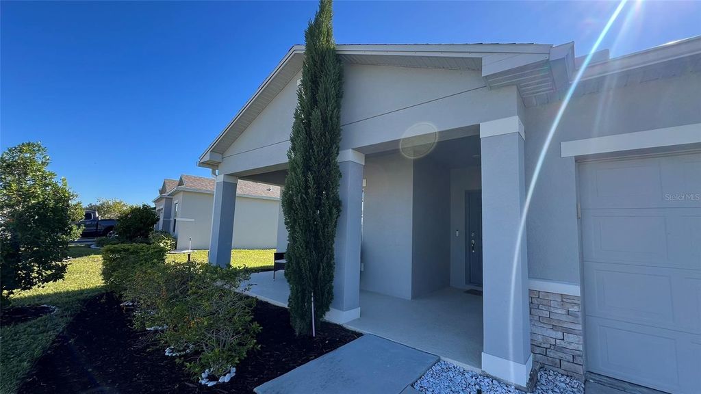 Photo of 136 Hamlet Loop, Davenport, FL 33837 (MLS # O6358747)