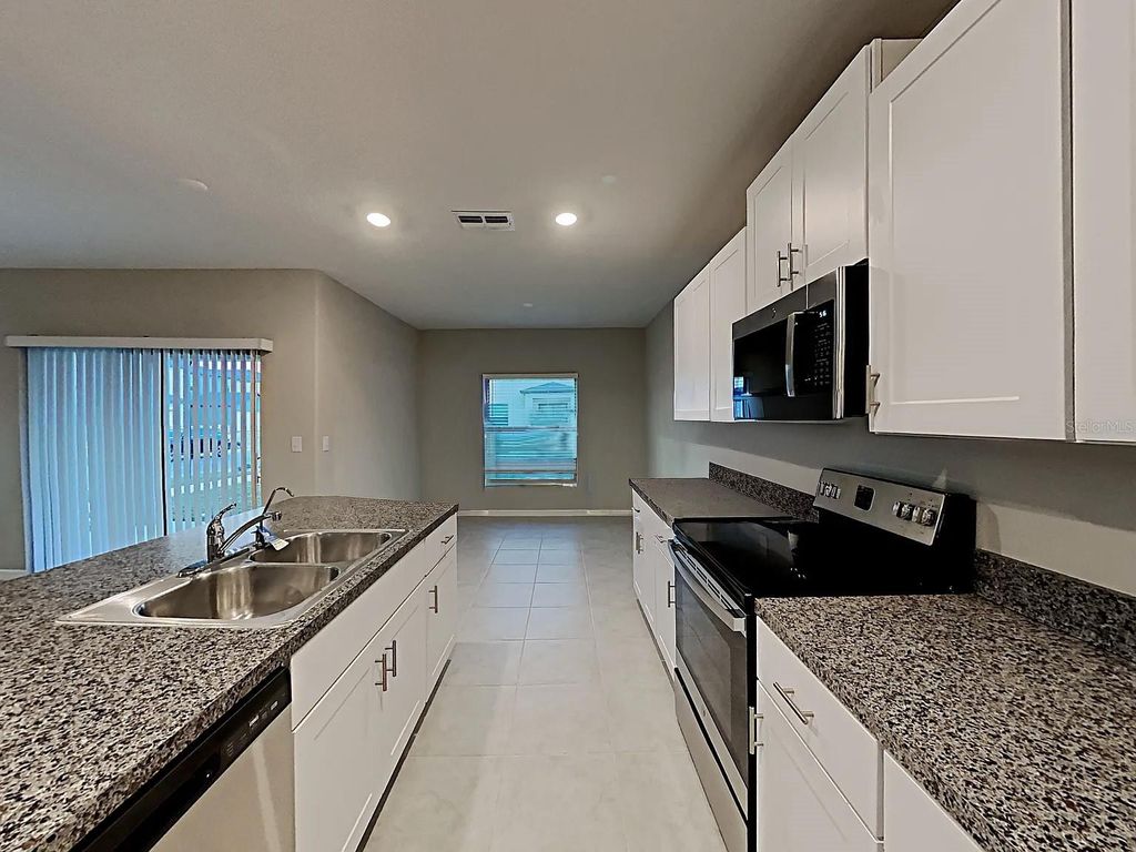 Photo of 4702 Summer Savory Street, Tampa, FL 33619 (MLS # TB8453000)