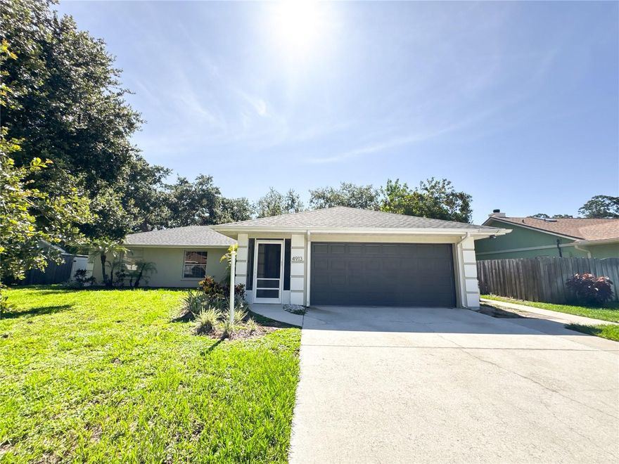 This 3 bedroom 2 bath slice of paradise is nestled in the quiet, relaxed community of Manatee Oaks. Boasting an open-concept floor plan, it has unique features such as a modern u-shaped kitchen, an active wood-burning fireplace, and a large primary en suite with a bonus sitting room. The impressive aspects of this property continue into the backyard space, transporting you into your own oasis with a grand caged-pool and gorgeous landscaping. The Southern Oak trees truly make this natural landscaping one-of-a-kind.