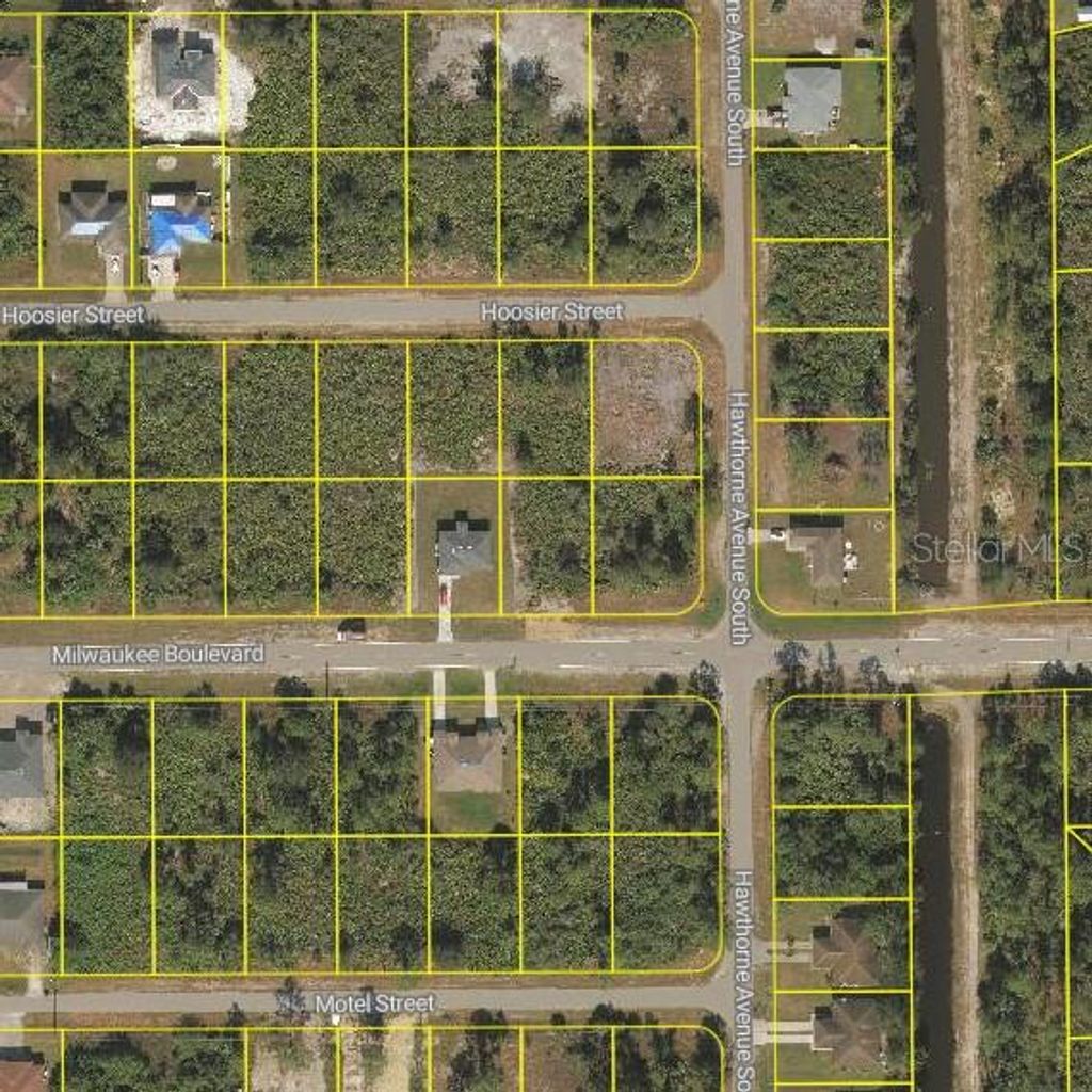 Photo of 881 Milwaukee Boulevard, Lehigh Acres, FL 33974 (MLS # O6400929)