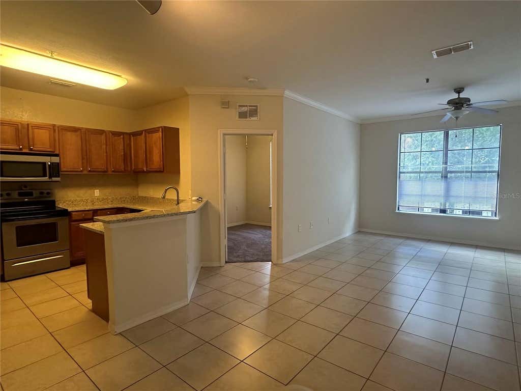 Photo of 6119 Metrowest Boulevard #103, Orlando, FL 32835 (MLS # O6431876)