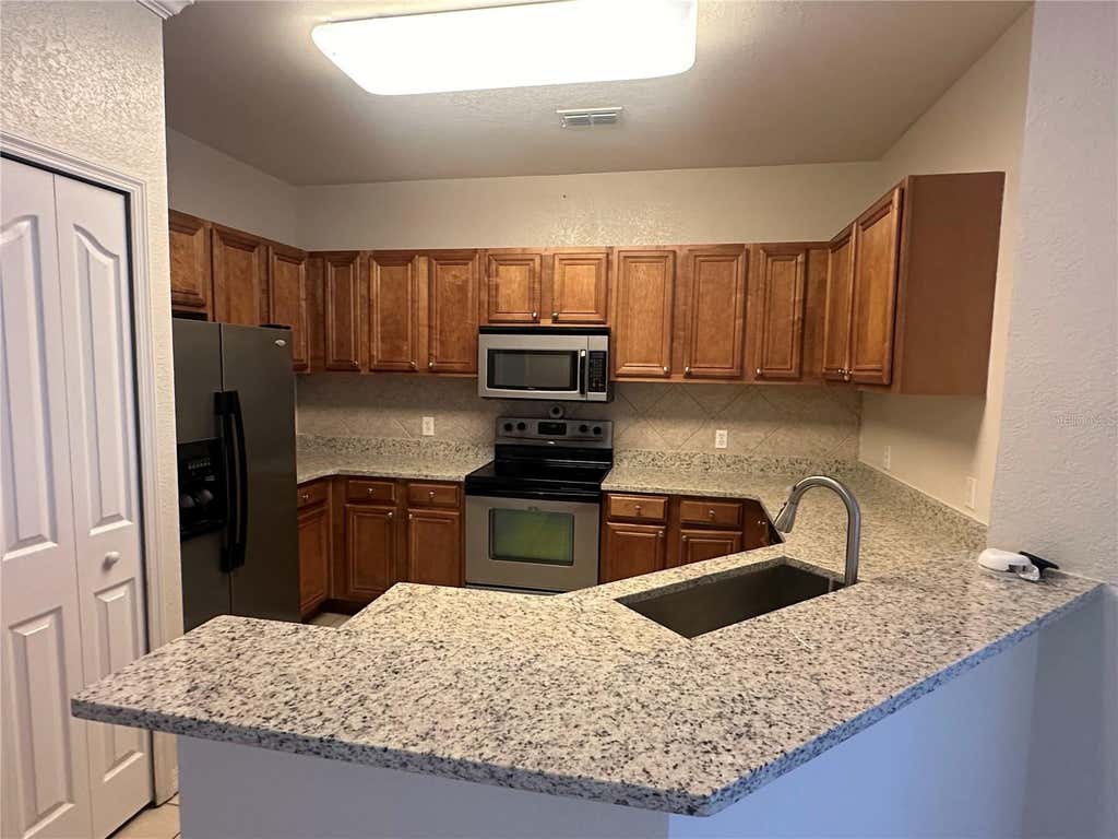 Photo of 6119 Metrowest Boulevard #103, Orlando, FL 32835 (MLS # O6431876)