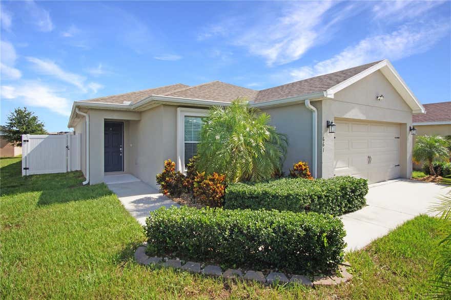 Discover comfort and convenience in this delightful 3-bedroom, 2-bathroom single-family home located in the heart of Haines City, FL. Perfectly blending style and functionality, this beautifully maintained residence offers a warm and welcoming atmosphere, ideal for everyday living and entertaining alike.

Step inside to find a contemporary kitchen thoughtfully designed with rich dark cabinetry, sleek stainless steel appliances—including a refrigerator, range, microwave, and dishwasher—and a handy pantry closet situated just beside the fridge for easy access to all your cooking essentials. The kitchen opens directly into a cozy dining space, where sliding glass doors lead you to an enclosed patio—perfect for enjoying morning coffee or hosting weekend barbecues. Beyond the patio, a spacious fenced-in backyard offers privacy and plenty of room to relax, garden, or let pets play.

Connected to the dining area is an expansive living room filled with natural light and equipped with a ceiling fan to keep things cool. Whether you're entertaining guests or simply enjoying a quiet evening, this space offers the versatility and comfort you need.

The thoughtfully positioned master suite, located near the kitchen, is a peaceful retreat featuring a ceiling fan, a large walk-in closet, and an en-suite bathroom complete with a stand-up shower for your daily refresh. Two additional bedrooms are located conveniently within the home, each with ceiling fans to enhance comfort year-round. A second full bathroom with a shower-tub combination serves these bedrooms and guests with ease.

Practical features continue with a tucked-away laundry closet for added efficiency, and the inclusion of solar panels brings the added benefit of reduced energy costs—an eco-friendly bonus for modern living.

Set in a convenient location, this charming home provides easy access to local shops, dining options, schools, and recreational spots, making it an ideal choice for anyone seeking a balanced lifestyle in Central Florida.

Don’t miss out on the opportunity to make this inviting property your new home. Contact us today to schedule a showing or to learn more!