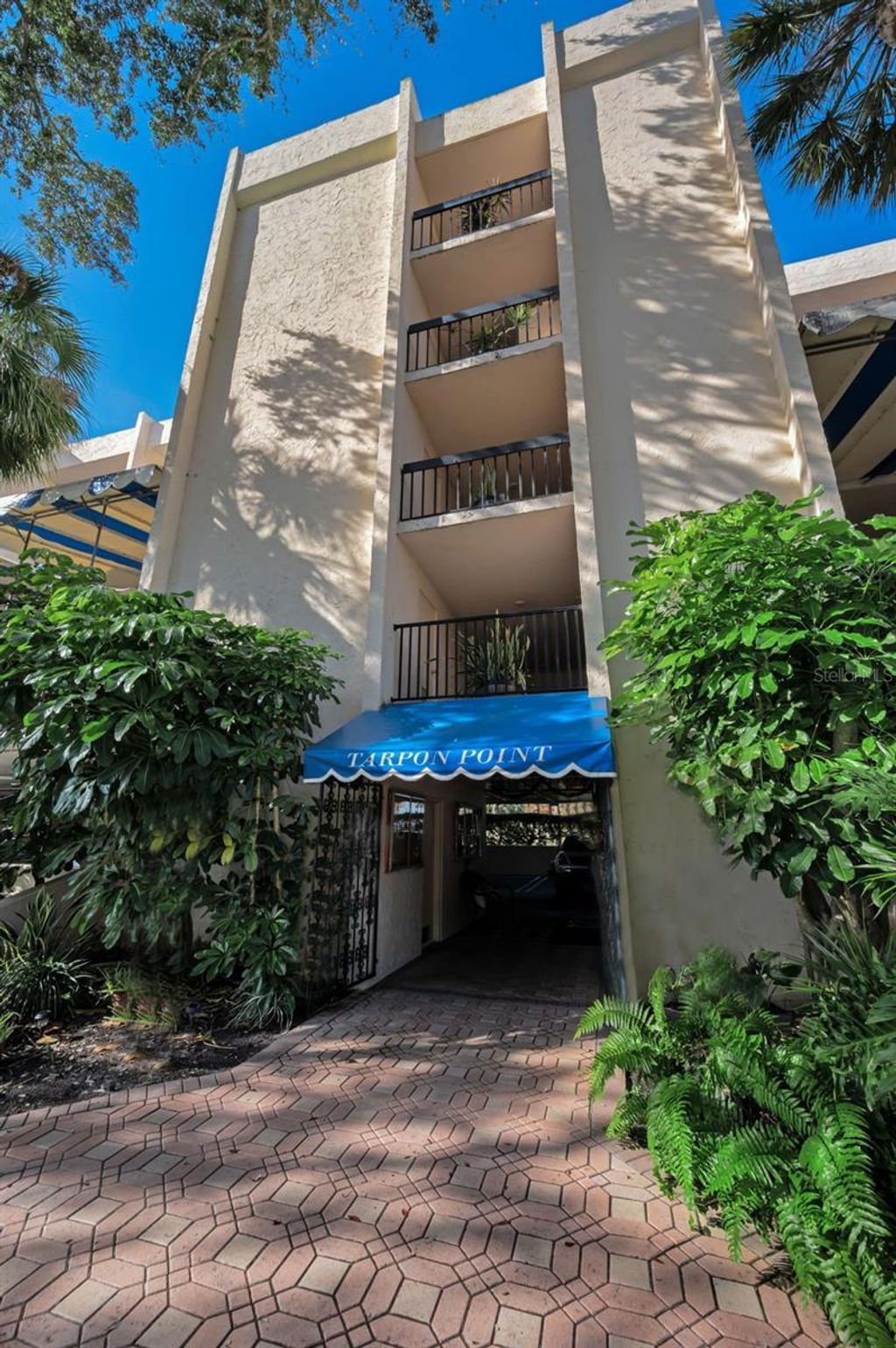 Photo of 203 Tarpon Point #203, Tarpon Springs, FL 34689 (MLS # TB8461745)