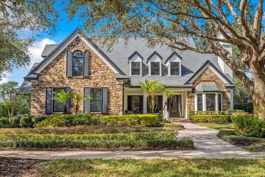 Keene's Pointe - gated/24-hour attended country club community featuring The Golden Bear Club, an 18-hole golf course designed by Jack Nicklaus featuring golf, tennis, fitness, swimming and dining.  Style and charm describe this well-maintained and updated home with stunning curb appeal and premium golf course frontage.  Boasting 5 bedrooms and 4 baths, the functional and open floor plan has an office/den with vaulted ceiling and gas fireplace, formal dining with adjoining wet bar, great room with two story fireplace, kitchen with stainless appliances and breakfast nook with banquette, spacious laundry, guest suite and master suite on the first floor.  The primary suite is sure to please with two vanities, soaker tub, walk-in shower and two large closets.  The second story houses a large storage/AC closet, one en-suite, guest bedroom with balcony overlooking the golf course and bonus room with the fifth bedroom.  There are two staircases that lead up to the second floor with a balcony overlooking the family room below.  This home has been completely updated to include all flooring (hardwood or tile), custom closets, as well as a new roof in 2022 and recent exterior paint and landscape lighting.  Perfect for entertaining and enjoying beautiful sunsets overlooking the 18th fairway, the great room provides access to the lanai with retractable screens leading to the multi-level pool with spa and lush landscaping.  This home also offers a mud area leading to the 3-car air conditioned garage, central vac, as well as paved driveway and walkways leading to the home and pool area.  Close to top-rated public and private schools, shopping, dining, expressways and major tourist attractions, this home has it all!