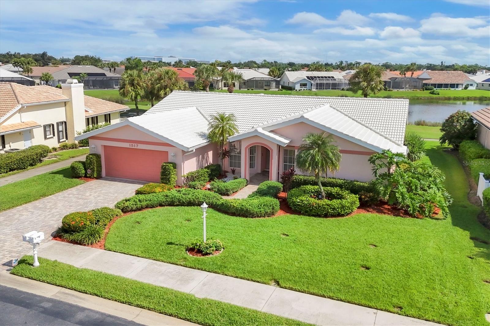 Located in Waterford, a gated, golfing, tennis community within minutes to Historical Downtown Venice, enticing beaches, Intracoastal Waterway and the Gulf of Mexico! This Golf front, lake front 4 bedroom, 2 baths, 2 car garage home is located on a "premier" lot of the "Signature Green" of the Waterford golfing community, Turnberry/Gleneagles 9! Built as a model home it features multiple sliding glass doors and volume cathedral/vaulted ceilings bringing in lots of light and sunshine year around! Enter through tiled foyer, volume ceilings into this lovely split bedroom model home that shows "Pride" of ownership throughout by "original owner"! Master suite is large and accommodating with volume ceilings, walk-in closet, master bath with glassed walk-in shower and vanity Plus your own private entry/exit through sliding glass doors to lanai overlooking golf course and lake!! This split bedroom plan gives privacy for all and allows choices for uses for bedrooms. Bedroom 4 with stylish French doors is centrally located and now used as an office/music room but ready for your needs. From foyer entry, your living room is light and bright with volume ceilings and the sliding glass doors (doors pocket to wall) to lanai overlooking golf course and lake. Formal dining room with wet bar and cabinetry conveniently located adjacent to kitchen. Spacious kitchen with newer stainless appliances overlooks and joins the family room for all those nice family/friends gatherings. Breakfast bar compliments kitchen and family room, sliding glass doors provides entry/exit to lanai. Lania is spacious and open giving beautiful panoramic views of golf course and lake. Bedrooms 2 and 3 are privately located adjacent to family room near bath 2 for convenience. Inside laundry room is spacious with laundry sink, cabinets, etc., and out to 2 car garage. Garage with overhead garage door opener nicely accommodates 2 vehicles plus your other needs. Handsome paver bricks and lush landscaping compliments the driveway and walkway to front entry of your home. Waterford is a highly sought after community and does not have CDD fees. Golfing is not required but reasonable, new pickleball courts in the near future! Community has on site management, clubhouse is updated, upgraded, multiple use rooms, gym has "state of the art" equipment, bathrooms, library, Junior Olympic heated pool, spa, picnic area with grills, tables, paver brick, Har-Tru tennis courts, outdoor bathrooms and viewing deck!! New AC 2025, roof 2008, exterior paint 2025, water heater 2020, paver brick driveway, entry 2018 and more, list available!