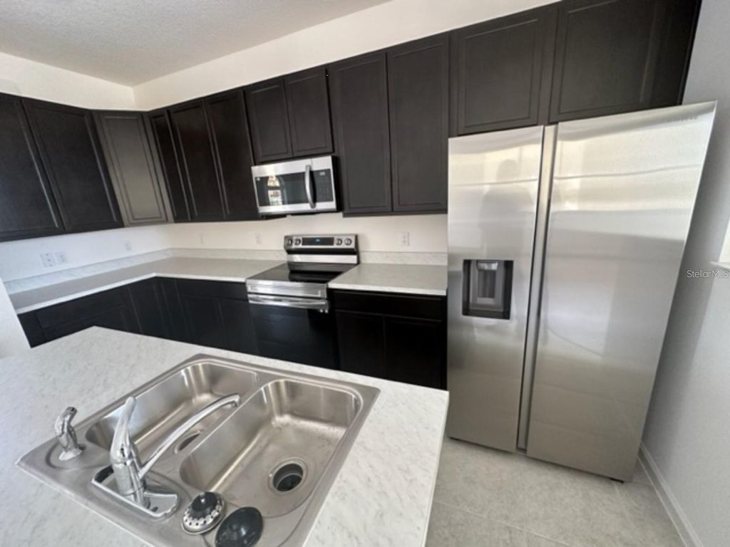 Photo of 263 Bella Prestwick Boulevard, Davenport, FL 33837 (MLS # S5141341)