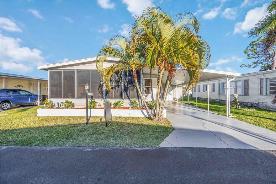 This beautifully maintained fully furnished  2 bedroom, 2 bathroom doublewide offers approximately 960 square feet of comfortable living space and has been thoughtfully updated so you can simply move in and start enjoying the Florida lifestyle.

From the moment you arrive, you will notice the extensive improvements throughout the home. Major updates include a new vapor barrier installed in 2022, a new roof in 2023 with transferable warranty, two hurricane slider shutters, a freshly painted driveway, a new carport roof following storm damage, and a new roof over the rear shed. A new door to the Florida room has been installed, and the Florida room also features brand new windows that enhance comfort and efficiency. Inside, the living room, guest bedroom, and primary bathroom have been freshly painted in soothing coastal tones that enhance the light and airy feel of the home.

The kitchen is designed for both function and gathering, featuring a large island with generous workspace and excellent flow into the main living areas. Beautiful luxury vinyl flooring runs throughout most of the home, adding durability and modern appeal. Two large sliding glass doors flood the interior with natural light and are equipped with high velocity accordion shutters for added peace of mind. Both bathrooms showcase stunning tile work that creates a spa inspired experience.

Enjoy relaxing mornings and colorful Southwest Florida sunsets from your spacious front porch, perfectly positioned to capture the breeze. The property also includes two storage sheds, one of which houses a newer washer and dryer for added convenience. The air conditioning system was replaced in 2020, providing reliable comfort year round.

Eagle Point is an active and welcoming 248 home waterfront community situated along Alligator Creek, which winds through scenic mangroves to the Intracoastal Waterway near the Gulf of Mexico. Residents enjoy abundant waterfront seating areas, a private boat launch, fishing pier with fish cleaning station, and available docking. The community also features a large activity center with regular social events, indoor games, and a library with WiFi. Outdoor amenities include a heated swimming pool, bocce ball, shuffleboard, horseshoes, outdoor grills, and a firepit gathering area. RV, boat, and trailer storage is available on site at little to no cost.

Eagle Point is a resident owned park share community. Buyers are required to purchase 20 park shares totaling $20,000 in addition to the home purchase price. The current HOA fee of $281.80 per month includes lot rent, water, sewer, trash removal, recreational facilities, and private road maintenance. The share investment is returned upon the future sale of the home, providing long term value.
 Nearby grocery options include Publix Super Market, ALDI, and Winn Dixie. Public transportation is available via Charlotte County Transit. Outdoor enthusiasts and pet owners will appreciate nearby dog friendly parks such as Gilchrist Park and the Punta Gorda Dog Park. Major roadways including Burnt Store Road, US 41, and Interstate 75 are easily accessible, making travel throughout Southwest Florida simple. Healthcare needs are well served by Bayfront Health Punta Gorda and Fawcett Memorial Hospital in nearby Port Charlotte. For air travel, Punta Gorda Airport and Southwest Florida International Airport are both within comfortable driving distance.