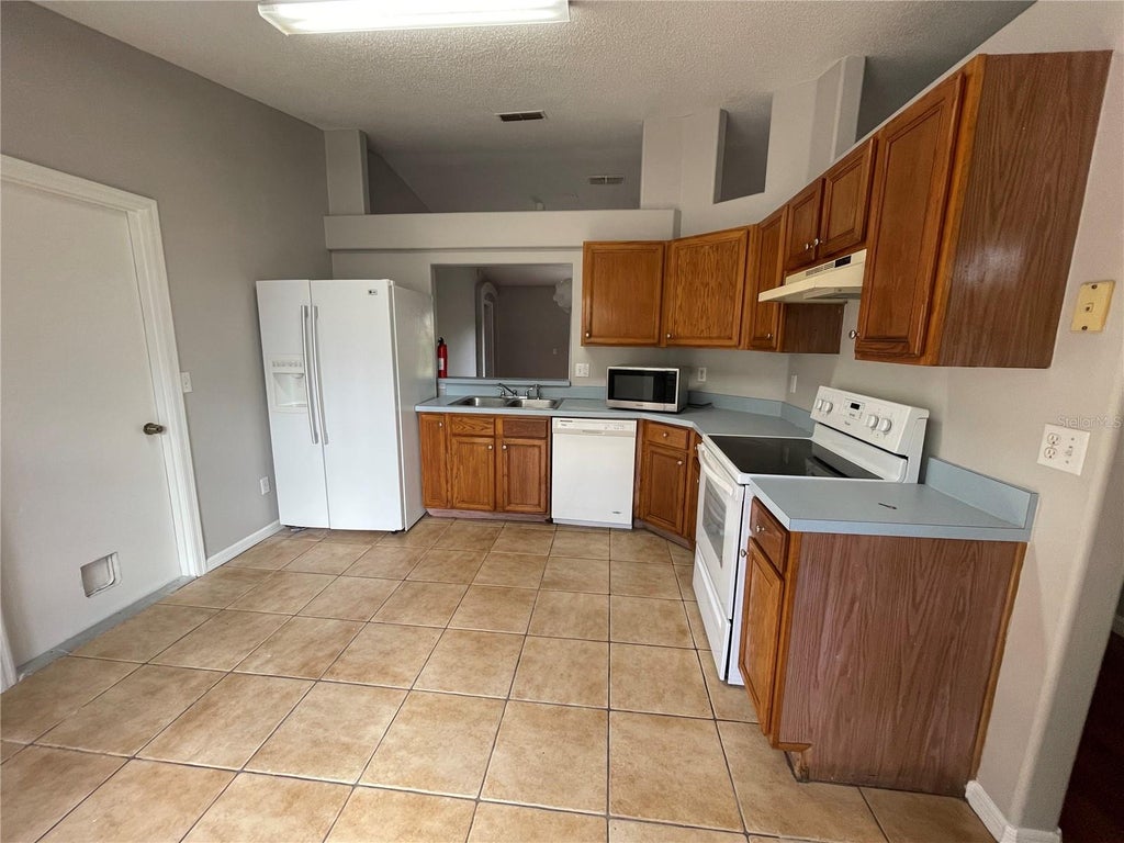 Photo of 11185 Cypress Leaf Drive, Orlando, FL 32825 (MLS # O6446940)
