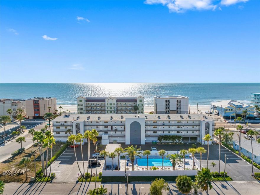 Beach access is directly across Gulf Boulevard, offering easy and quick access to the beach and the beautiful Gulf waters. This newly remodeled top-floor (4th-floor) condominium has one large bedroom and one and a half baths. Everything has been updated with designer finishes. The high-impact sliding glass doors offer safety and sound insulation. The kitchen has stainless Whirlpool appliances including dishwasher, refrigerator with ice maker, smooth top range and microwave. The large primary bedroom has a partial Gulf view and an oversized walk-in closet. The primary bath has a step-in shower and the guest bath is conveniently located off the hallway. The laundry room has a new GE stackable washer and dryer. The newer air conditioner is energy efficient and combined with the impact-resistant/insulated windows and sliding door results in energy efficiency. Internet service and cable are included. Luxury plank flooring throughout for that modern look and easy cleaning (no carpeting). The community has a large heated pool & patio deck and poolside restrooms. Close to several restaurants including the beachside Caddy’s Restaurant and Bar, coffee shops and John’s Pass Village and Boardwalk. No smoking or pets permitted.   See video at https://vimeo.com/1142092440