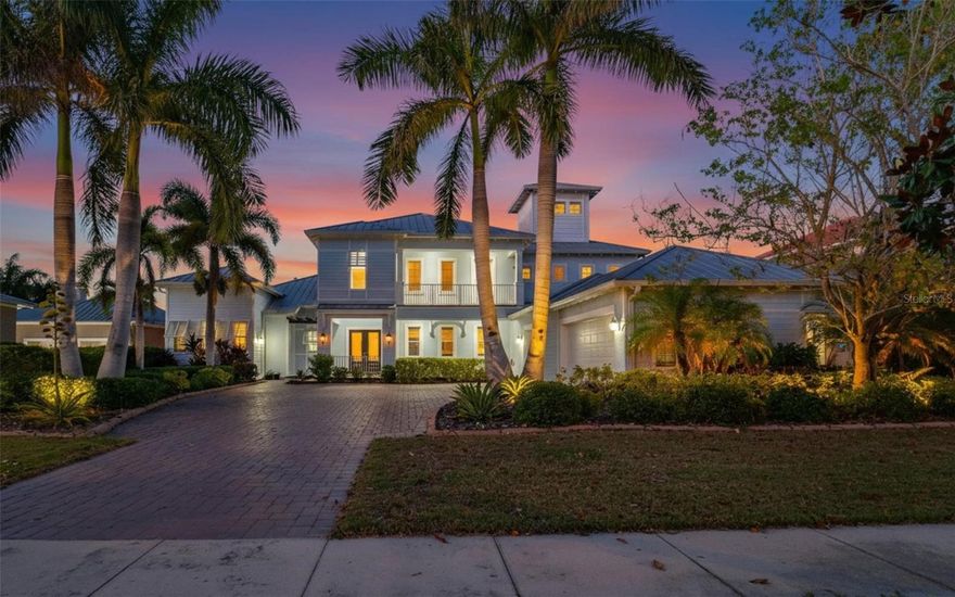 613 Balibay Dr, Apollo Beach, FL 33572 | 5 Bedrooms | 4 Bathrooms | 3,977 Sq Ft | 3-Car Plus Garage | Pool and Spa | Canal Front | Dock with dual Lift
Most buyers never make it inside Bay Estates. It is a gated enclave within MiraBay, tucked behind the main gate, where the lots exceed 100 feet and every home is a one-of-a-kind custom build by an award-winning builder. This is one of those homes. A John Cannon Cape Cod on a saltwater canal with direct access to Tampa Bay -- nearly 4,000 square feet across 2 levels, and it shows from the moment you pull into the paver driveway.
The great room stops you. Soaring ceilings, dramatic tray ceiling detail, custom chair rail and crown molding, plantation shutters, and sliding glass doors that frame the canal like a painting. Luxury wood look, long plank, vinyl flooring runs the main level and doors open from the great room, primary suite and kitchen directly to the lanai, so the inside and outside are never really separate.
The kitchen was built to host. Double islands with quartz countertops, a SubZero-style refrigerator, double ovens, stainless appliances, wood cabinets with crown molding, a built-in wine rack, and a ceramic sink. Culligan whole-home water purifier and reverse osmosis drinking system in place. Whole-home RJ-45 network and JBL in-wall surround sound throughout.
Three Bedrooms, living, dining and a flex space are on the first floor, including the primary suite with tray ceilings, wood flooring, French doors to the lanai, two custom walk-in closets, dual vanities, a jacuzzi tub, and a walk-in shower with multiple shower heads and a built-in bench. Upstairs, the bonus room/loft  has a wet bar, mini fridge, bead board, and a balcony looking straight down at the pool and canal. Two bedrooms flank it, both with front and back views from balcony access. A spiral staircase takes you to a third-level loft -- a private oasis above it all.
Then there is the backyard. Travertine pavers surround a heated pool and 10-person spa built in 2019, complete with fountains, Jandy LED lighting, and underwater barstools. The outdoor kitchen features all you need for entertaining-- Blaze natural gas grill, ice maker, refrigerator, storage drawers, LED lighting, JBL outdoor speakers. At the dock, a 25,000 lb boat lift handles anything you want to put on it. Combined with a tandem jet ski lift -- a grandfathered setup no longer permitted under current regulations -- this dock cannot be replicated anywhere on the market today. Seawall replaced 2021.
This home has been maintained and upgraded to a standard most custom homes never reach. Generac 24kW whole-home generator covers the house and all lift systems. Both Jandy variable speed pumps and all ten pool lights replaced. New AC (2021), hot water heater (2021), Haiku fans throughout, full repaint (2022). Active service contracts on HVAC, water, pool, and generator. The oversized garage fits three cars plus a golf cart or fourth vehicle and is finished with epoxy floors, new openers, and SafeRacks shelving.
MiraBay Bay Estates is the kind of address that takes years to find and rarely comes available. Enjoy full access to the Mirabay Amenities including Two heated pools, 24-hour fitness center, tennis, pickleball, basketball, kayak launch, and golf cart access to MiraBay Village. CDD covers community seawalls. US-41, I-75, Tampa, MacDill AFB, and the Gulf are all within easy reach. Schedule your showing before someone else does.