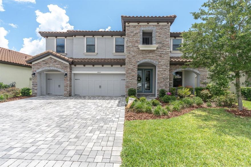 Experience elevated living in this highly sought-after Virginia Park floorplan by Homes by WestBay, perfectly positioned in the heart of Starkey Ranch. Built in 2022, this exceptional 5 bedroom, 4 bathroom, plus office and bonus room, pool home combines timeless finishes, thoughtful design, and resort-style outdoor living in one of Tampa Bay’s most coveted communities.

A grand double-door entry welcomes you into a bright and open layout featuring soaring ceilings, crown molding, and beautiful wood-look tile flooring throughout the main living areas. Designed for both everyday living and entertaining, the gourmet kitchen truly stands out with an oversized island featuring additional storage cabinetry, quartz countertops, white shaker cabinetry with glass display accents, tile backsplash, pot filler, glass pantry door, and premium Café appliances including a double oven gas range. The kitchen flows seamlessly into the spacious great room where oversized sliding glass doors create effortless indoor-outdoor living.

The first floor offers a private guest suite complete with a walk-in closet and full bathroom featuring a walk-in shower, making it ideal for guests or multigenerational living. Downstairs features a double glass door home office or flexible space for your needs.

Upstairs, you’ll find an oversized bonus room along with the luxurious primary suite and three additional guest bedrooms. The primary retreat offers a spa-inspired bathroom with dual vanities, a soaking tub, tile-to-ceiling walk-in shower, and separate his-and-her walk-in closets. Secondary bedrooms are generously sized with ample closet space and beautifully finished bathrooms.

Step outside to your private backyard retreat featuring a heated pool and spa with PebbleSheen finish, along with gas and water rough-ins already in place for a future outdoor kitchen. This exceptional outdoor space was designed to enjoy the Florida lifestyle year-round.

Additional upgrades include a tile roof, tankless water heater, water softener, laundry room with cabinetry and utility sink, hurricane shutters, paver driveway, and zoned HVAC systems. Located in an X flood zone (no flood insurance required for lender) and built to current construction standards with double pane windows for added peace of mind and energy efficiency.

One of the most impressive features of this home is the combination of luxury finishes, functional layout, and exceptional indoor-outdoor living spaces rarely found together in today’s market.  Starkey Ranch is a serene neighborhood for all outdoor lovers, providing 3 community pools, multiple playgrounds throughout, soon to be 20 miles of walking/running/biking trail paths, dog parks, community garden, kayak lake, and more. The neighborhood features the New Starkey Ranch K-8 STEM Magnet School, the library/theater, and District Park offering fields for all your favorite sports & an amazing playground. Cunningham Lake is in your backyard—a beautiful place to enjoy the outdoors!! Starkey Ranch offers an activities director with fun for all ages. Excellent schools, 30 minutes to airport, 30 minutes to beautiful beaches, nearby major shopping, restaurants, and nightlife.
