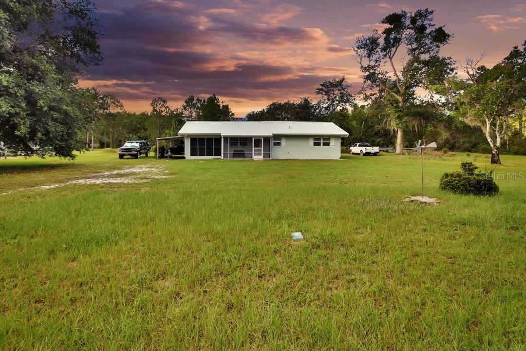 Outdoor lovers' paradise! Sitting on over half of an acre this PRISTINE 3-bedroom 2 bath home is on Blue Creek canal with access to the lake and river. The recently remodeled interior features include ceiling fans, updated bathrooms with upgrades, dining room, living room and Florida room/office. With two screened porches you can sit outside and enjoy the peace and quiet of the Ocala National Forest. This is a highly sought after neighborhood and puts you on the water for a fraction of the cost and high taxes of neighboring counties. There are so many activities for this area which include trails for hiking and mountain biking, horseback riding, hunting and fishing and exploration of the forest, Photography buffs will appreciate the scenic surrounds as well. Exterior perks include brand new metal roof, new A/C unit, commercial grade water heater, a whole house dehumidifying system, interior laundry room and more. The craftmanship of this home is evident in all the details. There is so much more but don't take our word for it, see for yourself and make your appointment today. This is truly a one-of-a-kind home that puts you where many wish to be. With water access you can spend the days boating and fishing. This is a perfect hunting lodge for out of towners or fishing enthusiasts. This home is limited only by your imagination. NO HOA. No flood claims filed by current owner. BRING ALL OFFERS!
*All descriptions, measurements and ALL zoning to be verified by Buyer and Buyes agent.
Zoning may allow horses. Call Lake county for information regarding zoning and flood maps