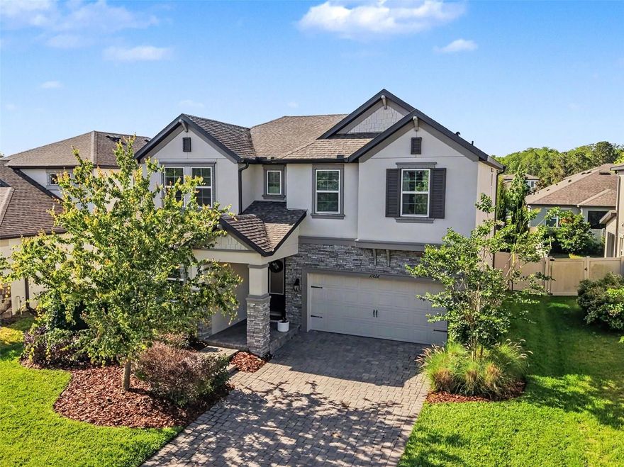 Welcome home to this immaculately maintained 4 bedroom 3 bathroom in the highly sought after community of Starkey Ranch. Pulling up to the home you will immediately notice the curb appeal along with a large front porch and no neighbors across the street! 

Inside, the thoughtfully designed layout includes a full bedroom and bathroom on the first-floor. Continue through the foyer and be prepared to be WOWED. From the abundance of natural light flowing through the TWO sliding glass doors to the designer finishes throughout the kitchen and great room. The kitchen is a chefs dream, with a large island, ample counter space and a separate dining area large enough for any gathering. 

Attached to the kitchen is the oversized great room with custom build electric fireplace and cabinetry for additional storage. The great room provides unobstructed views through the entire wall of sliding doors to allow for natural light to pour into the home. 

Proceed upstairs to fine a nicely appointed loft/bonus room with build in storage, two additional spare bedrooms and a wonderful primary suite featuring an abundance of windows, trey ceilings and enough space to have a seating area as well. The ensuite bathroom offers dual vanities, a walk in shower and HUGE closet! The two additional spare rooms share an additional bathroom with dual vanity and shower/tub combo. 

The large fully fenced backyard  was designed for both everyday living and entertaining, the extended patio overlooks a spacious backyard, creating a seamless indoor-outdoor experience. 

This home is conveniently located within the community. You are walking distance from the newest of THREE parks/pools, close to the Starkey Ranch k-8 school and so much more! This home offers a rare blend of style, function, and modern convenience. Call today for your private VIP tour or virtual showing.