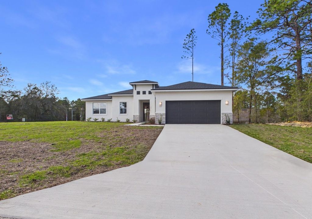 Photo of 7057 SW 131st Loop, Ocala, FL 34473 (MLS # OM717858)