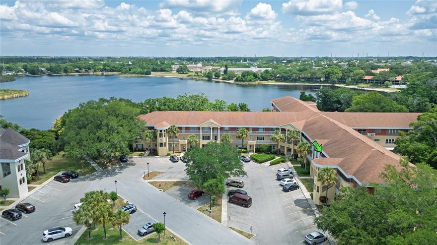 Top floor condo in the desirable gated area of Paradise “Top of the World,” offering comfort, convenience, and the easy Florida lifestyle buyers are looking for. Golf is FREE for residents! Tucked inside a newer building with no through traffic, this residence also sits in a non flood zone, adding extra peace of mind. With 1,370 sq ft, vaulted ceilings, elevator access, and handicapped accessibility, this home is designed for effortless living. The bright, open layout feels spacious from the moment you step inside, with newer luxury vinyl flooring and a large living room that’s ideal for relaxing, entertaining, or simply enjoying quiet evenings at home. A rich accent wall adds warmth and style, while the updated kitchen features newer appliances, recessed lighting, and opens to a flexible second living or dining area. The oversized primary suite offers a comfortable retreat with vaulted ceilings, generous natural light, and plenty of room to unwind. The en suite bathroom includes a newer double sink vanity, and a full size, permitted washer and dryer are included for everyday convenience. Major updates include AC in 2022, water heater in 2025, and an updated electrical panel, giving the next owner confidence in the home’s important systems. Step outside and enjoy one of the community’s best lifestyle settings near Harbor Lake, scenic walking trails, peaceful green spaces, and the golf course. Whether you’re starting the morning with a walk by the water, spending the afternoon at the pool, or meeting friends for activities, everything is close and easy to enjoy. Shopping, dining, and complimentary community bus services are also just minutes away. Residents enjoy a vibrant, active 55 plus community with two free golf courses, two pools including one heated, a dog park, newly renovated fitness center, and a full calendar of activities including dancing, cards, billiards, and more. Pet friendly and low maintenance, with monthly fees of approximately $553 covering roof, water, building insurance, and more. Located within a sought after gated community, this home offers the privacy, convenience, and lifestyle that make Paradise “Top of the World” such a special place to call home. Settle in, relax, and enjoy the Florida lifestyle you’ve been waiting for.