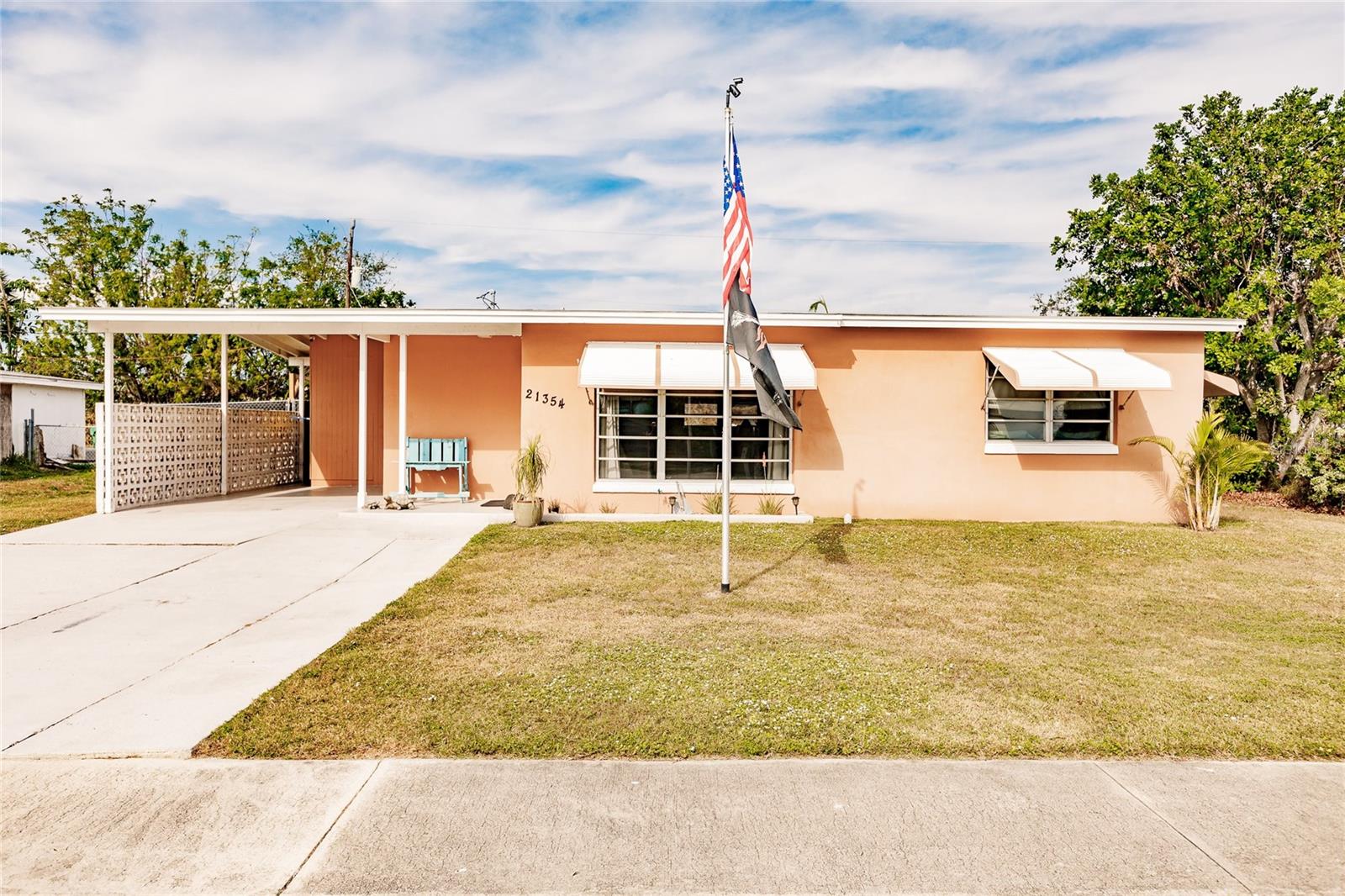 Attention Investors, First-Time Buyers, and Snowbirds! Discover this charming and well-maintained 2-bedroom pool home tucked away in a peaceful neighborhood in the heart of Port Charlotte. The open floor plan offers spacious living and dining areas, a functional kitchen, and a cozy Florida room—giving you plenty of flexibility to create your ideal living space. Beautiful terrazzo flooring runs throughout the home, complemented by wood-look tile in the Florida room for added warmth and character. The kitchen has been thoughtfully updated with brand-new stainless-steel appliances, rich wood cabinetry, and a breakfast bar that flows easily into the living areas—perfect for casual gatherings and entertaining. Additional features include a dedicated laundry room with pantry space and overhead cabinets, an above-ground pool for cooling off in the sunshine, a hurricane-rated storage shed with electricity, storm shutters, updated electrical outlets and switches, and a fully fenced backyard. You’ll also appreciate the clam shell awnings, public water and sewer, and the reassurance of major updates already completed—proving this home’s age is nothing but a number. And best of all, it’s not in a flood zone. Ideally located near beaches, waterways, golf courses, restaurants, and shopping, this home also offers easy access to public parks with bike and walking trails, picnic areas, and boat ramps leading to the Peace and Myakka Rivers, Charlotte Harbor, and the Gulf of Mexico. Move-in ready and full of charm, this home is ready for you to enjoy the best of Florida living. **PLEASE ENJOY THE 3D INTERACTIVE VIRTUAL TOUR ASSOCIATED WITH THIS LISTING