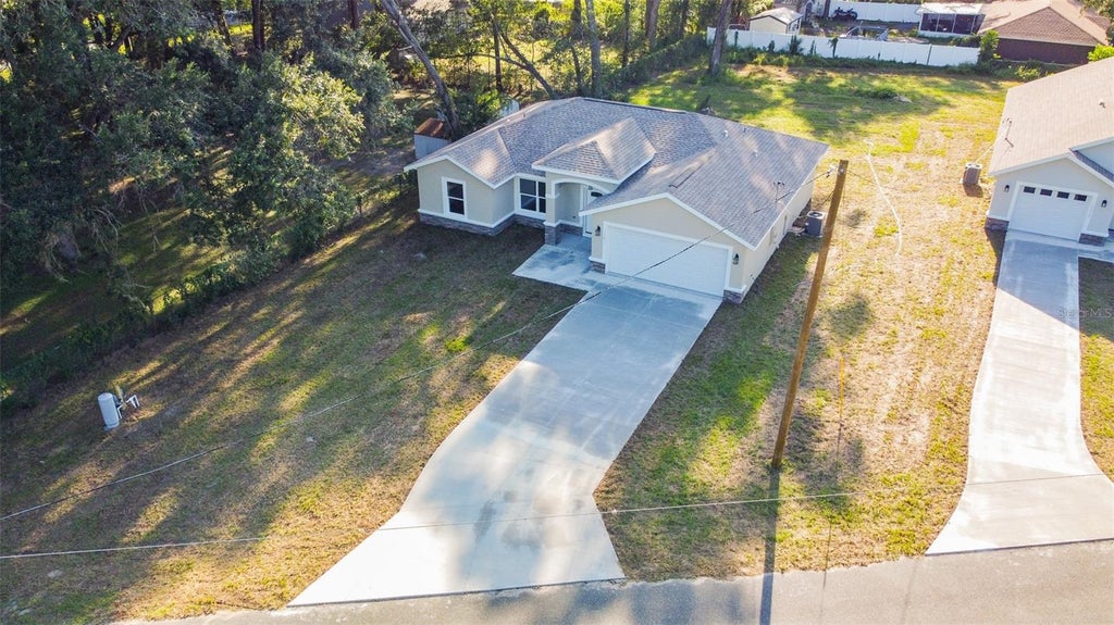 Photo of 12428 SE 72 Avenue, Belleview, FL 34420 (MLS # OM732645)