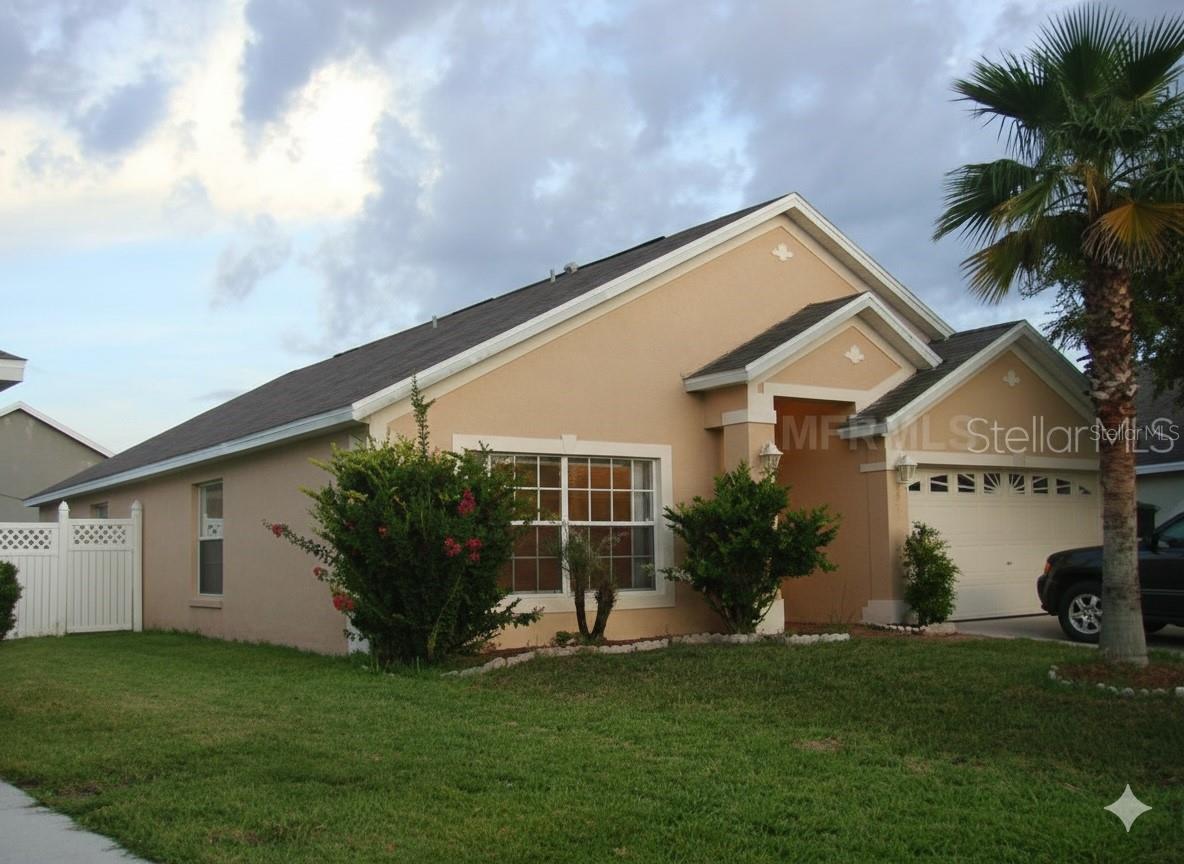 Beautiful Home in the Gated Community of Regency Place. This spacious residence offers nearly 2,000 sq. ft. of living space with 4 bedrooms and 2 bathrooms. The home features like-new porcelain tile throughout, new blinds, and a formal living and dining room. The large kitchen with an additional dining area flows into a comfortable family room with sliding doors that open to a fully fenced backyard. The master suite connects to the second bedroom with elegant French doors—perfect for an office, nursery, or private sitting area. Located in a prime area near I-4 and Hwy 27, Regency Place is just minutes from Disney World, Celebration, Posner Park Shopping Mall, and more. The subdivision is adjacent to the Posner Park Chrysler Dodge Jeep dealership. Enjoy the convenience of a fast approval process and a great location with endless nearby amenities.