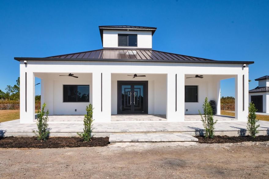 Welcome to your private paradise and live the dream Florida lifestyle with space. If you are a horse lover or want a hobby farm, this is the place to live your dream on this secluded 5-acre property fully fenced in X flood zone plus elevated ground with new fresh fertile soil brough in to support well drainage rich agricultural use. Property located at private dead-end dry road with new asphalt millings coating lay last summer and minutes from 75. Come and see what this custom contemporary country modern design has to offer. Built in 2025 to withstand beyond CAT 5 hurricane. Main house with solid concrete walls ICF (insulated concrete form) Rated 250+ MPH, and roof trusses design for 200 MPH. Entry porch with concrete roof Insul-Deck (insulated concrete form), entire building envelope exceeds State and County Energy and Building codes. Offers open floor plan design with 12’ ceilings and a center copula and oversized windows that bring plenty of natural daylight without need to use interior lighting, oversized porcelain flooring tile thru out with 6” porcelain base molding. Luxury GE Profile appliance package with gas stove, water heater, auto-powered Moen faucet and custom white shakers’ cabinetry with beautiful quartz countertops, a huge island and breakfast coffee bar.


RV Pad: In addition to the house, a concrete pad of 40’X30’ with 6” of concrete slab and 12” perimeter footings provide a nice parking area for your recreational vehicles with 30- & 50-amps electrical service, water hose bit, sewer hook-up and gas line available for future summer kitchen.


Owner future master plan for this property offers custom design for a 2nd home, swimming pool, cabana family room, and oversize garage. Come and see what this property has to offer, it does not get any more private than this one.