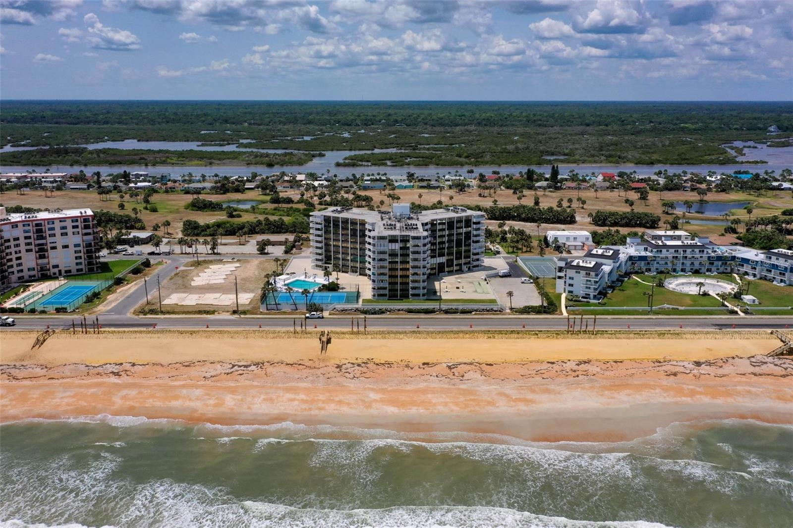 Enjoy the best of coastal living at the Nautilus in Flagler Beach—where breathtaking golf course sunsets meet direct beach access. This fully updated and stylish 2-bedroom, 2-bathroom condo offers 1,121 square feet of move-in-ready comfort, complete with a private west-facing balcony that captures sweeping sunset and fairway views. Inside, the unit features luxury finishes throughout, including granite countertops, solid wood cabinetry, Samsung stainless steel appliances, and a blend of luxury vinyl plank and tile flooring. Both bathrooms are beautifully updated with floor-to-ceiling tiled showers, and the entire space has been freshly painted for a modern, clean look. Located in a direct oceanfront building, Nautilus residents enjoy deeded beach access via a private stairway—perfect for morning walks on the sand. Community amenities include a beachfront pool, tennis courts, grilling area, fitness center, underground parking, and private storage, all designed to enhance your everyday lifestyle. Whether you're looking for a full-time residence or a relaxing coastal getaway, this condo offers unbeatable value, location, and style. Just minutes from the heart of downtown Flagler Beach, you'll love the easy access to charming restaurants, boutique shops, and lively local events—with St. Augustine, Daytona Beach, and the Intracoastal all just a short drive away.
Don't miss this rare opportunity to enjoy beachside living with golf course serenity—schedule your private showing today!