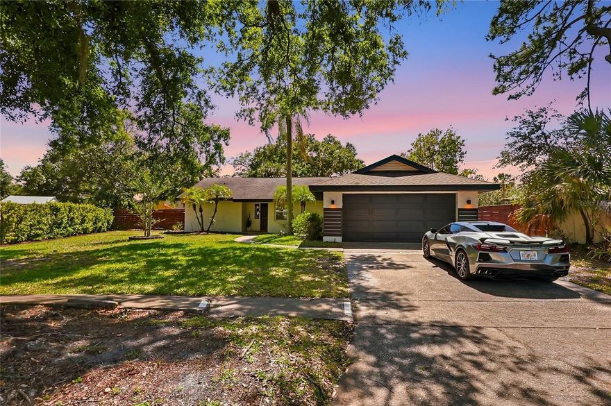 Beautifully upgraded and officially a 3-bedroom, 3-bathroom home, this move-in-ready property blends modern design with comfortable Florida living and thoughtful, high-end improvements throughout. The standout feature is the newly constructed primary suite, thoughtfully converted from a former music recording room into a spacious retreat complete with a brand-new en-suite bathroom featuring a walk-in shower and a custom-built walk-in closet, elevating both functionality and value. Inside, the home offers an open-concept layout with a fully clean and bright kitchen showcasing sleek cabinetry, built-in stainless steel appliances, a large granite center island with built-in cooktop, a wine fridge, and contemporary finishes that flow seamlessly into the living and dining areas—perfect for everyday living and entertaining. Both additional bathrooms have been tastefully updated, providing a cohesive, modern feel throughout the home. Major system upgrades include a new HVAC system, new water heater, new water softener, and new dishwasher, giving buyers peace of mind for years to come. Step out back into your own private backyard oasis, where you’ll find a resort-style pool surrounded by low-maintenance turf, a spacious seating and lounge area, and plenty of room for outdoor activities or hosting gatherings. The yard is fully fenced for privacy and includes a child safety fence for the pool, along with security cameras already installed for added convenience and protection. The home also features a two-car garage, extended driveway, and charming curb appeal. With its functional layout, extensive upgrades, and seamless blend of style and comfort, this home is truly turn-key and offers an exceptional opportunity for buyers seeking a modern, upgraded property in a desirable setting.