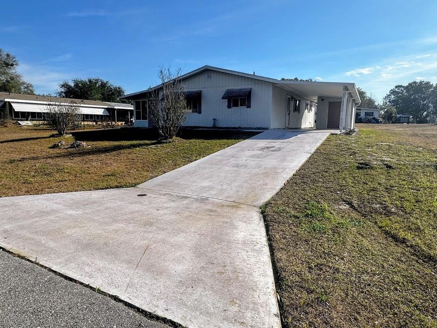 --INVESTMENT OPPORTUNITY FOUND HERE!-- Welcome to Ocala's Pine Run Estates, a 55+, low-HOA, pet and golf-cart friendly community where you OWN YOUR OWN .21-acre lot! NO LOT RENT/ NO FLOOD ZONE. This 1,144 square foot, single family home offers BIG INVESTMENT POTENTIAL. This property feels spacious, a lovely floor plan with open-concept living and dining space, sliders leading to the covered side porch. Two larger bedrooms and 2 full baths provide functionality. We love the storage space including the primary bedroom's walk-in closet, hallway linen closet, plus 2 bathroom closets for your items. Enjoy gated, paved-road entry from Hwy. 200- your home sits high on the land, offering curb appeal, and easy covered, carport parking. Washer/ dryer hookup located in the additional storage room. The low monthly HOA provides access to the clubhouse, community pool, fitness center, tennis courts, and covers trash pickup. FIXER UPPER opportunity, AS-IS Cash Sale, Pet-friendly, fences OK, properties may be leased. If you are looking for your next project this Spring Season, DON'T MISS this one! Priced to Sell Quickly & MUST SEE PROPERTY IN PERSON BEFORE OFFERING.