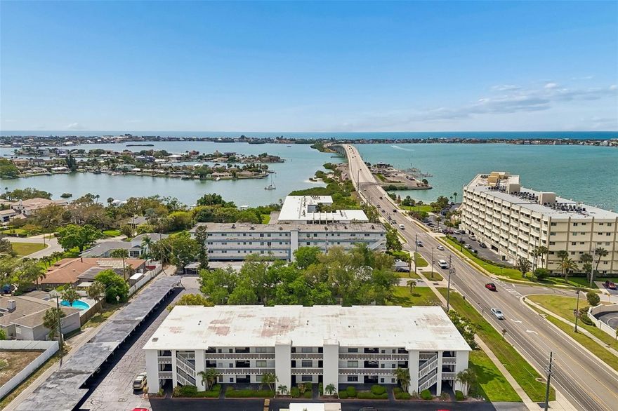Welcome home to this charming, move-in ready condo ideally situated in the heart of Belleair Bluffs, one of Pinellas County’s most desirable coastal communities. Perfectly positioned just steps from the iconic Belleair Bridge Marina and public boat ramps, this all-ages first-floor residence offers an affordable opportunity to enjoy the Florida lifestyle surrounded by water, sunshine, and everyday convenience. Whether you’re heading out for a sunset cruise, grabbing brunch at a local favorite, or spending the day at the nearby award-winning Gulf beaches, this location truly makes everyday feel like a vacation.

As you arrive, you’ll appreciate the convenience of your own covered carport just steps from the front door. Inside, this well-maintained 2 bedroom, 2 bathroom condo offers a comfortable and functional layout designed for easy living. The kitchen has everything you need with stainless steel appliances, excluding the refrigerator, along with a large pantry that provides excellent additional storage. The living and dining room combination feels bright and inviting, featuring wood-look tile flooring and a seamless flow into the sun-lit enclosed patio, creating the perfect space to relax, unwind, or enjoy your morning coffee.

The split bedroom layout offers both comfort and privacy, with luxury vinyl plank flooring in both bedrooms for a clean and updated feel. The oversized primary suite features dual closets and its own ensuite bathroom, while the guest bedroom is conveniently located near the second full bathroom, ideal for visitors or everyday use. Step outside to the enclosed sunroom where you’ll also find a private storage closet, adding even more practical functionality to the space.

This well-kept community offers an elevator, common laundry room, beautifully landscaped courtyard views shaded by mature oak trees, and a low-maintenance lifestyle that is hard to beat. Association fees include water, sewer, trash, grounds maintenance, building maintenance, roof, basic cable TV, and insurance on the building, giving you peace of mind and easy ownership. With no flood insurance required, a pet-friendly policy allowing two cats, and a 3-month minimum rental policy, this property is an excellent option for a full-time residence, seasonal getaway, or investment opportunity. Don’t miss your chance to own your own slice of paradise in Belleair Bluffs.