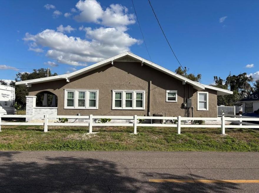 Step into timeless charm with this beautifully restored Craftsman home, ideally located just off Highway 92 and Combee Rd and only one block from Lake Parker—offering both convenience and a peaceful setting!
This home has undergone a top-to-bottom restoration with exceptional attention to detail, showcasing quality materials and craftsmanship built to last. Enjoy relaxing mornings on the spacious front porch or unwind in the private backyard retreat, perfect for quiet evenings or entertaining.
Inside, the main home features 3 comfortable bedrooms with ceiling fans that share a bathroom, along with a private master suite complete with its own bathroom and walk-in closet, creating a perfect balance of space and privacy. The thoughtfully designed layout offers both functionality and charm throughout.
Adding incredible value and versatility, the property includes a converted 30x10 garage with 1 bedroom and 1 bathroom, ideal as an ADU (Accessory Dwelling Unit) for guests or rental income. With income potential exceeding $3,000, this is a fantastic opportunity for investors or homeowners looking to offset their mortgage.
Additional highlights include new roof, windows, doors, and appliances throughout, as well as large paved parking with full RV hookups and a second driveway dedicated to the ADU, offering convenience and flexibility for multiple uses.
Whether you're looking for a beautifully updated home, an income-producing property, or both—this Craftsman gem near Lake Parker is a rare find you won’t want to miss!
