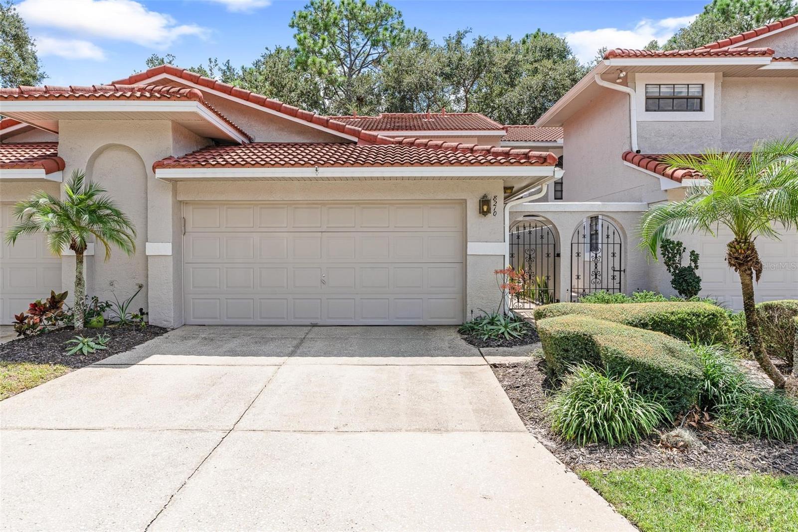 Welcome home to your move in ready Naples floor plan in the desirable and gated Sandpointe Townhomes in the heart of Dr. Phillips with excellent schools and located around the corner from the community pool and amenities and across the street from the famous restaurant row. New tile roofs in 2021. The secure gated courtyard leads you to the foyer and an open floor plan with expansive 16 foot ceilings & built in shelving that are ideal to display your most prized artifacts. Upgraded rich wood floors lead you to the living room and dining room and on to the first floor master bedroom featuring an en-suite bath with dual vanities, a walk-in closet, garden tub and separate bathroom and shower stalls. The spacious kitchen features stainless steel appliances and a breakfast nook that overlooks your private courtyard; the ideal location for a cookout or to grow your private organic herb garden. The kitchen features a breakfast bar that opens up to the dining room making it ideal to serve your guests your favorite culinary creations. The half guest bath is privately tucked away next to strairway with a spacious under stair storage closet. The charming second floor hallway overlooks the 1st floor living areas and leads you to the 2nd and 3rd bedrooms featuring a shared Jack and Jill bath. The enclosed 1st floor patio / Florida room provides approximately 75 square feet of living space making it ideal as an office or yoga / art studio. Sandpointe offers a club house with a kitchen, a heated community pool, fitness studio, Bocce Ball court & tennis courts. Resort style living at its best in a gated community, with the HOA taking care of the exterior & roof maintenance, all the lawn maintenance plus a termite bond for your peace of mind. Enjoy an evening stroll to Trader Joe's & The Parkside community park which are around the corner. The Marketplace is minutes away featuring a wide array of shops & restaurants including Christini's Ristorante Italiano, a Greenwise Publix, Starbucks & Home Goods for your last minute shopping needs. Preview your favorite book at Barnes & Noble, or visit one of the many restaurants on the famous Restaurant Row to curb any craving you may have. Dellagio is also around the corner offering specialty restaurants such as Dragonfly Sushi & Fleming's Steakhouse. All this in quite possibly one of the best locations in SW Orlando, close to major highways, shopping malls and all the area attractions.