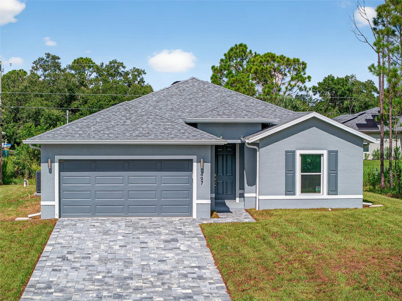 JUST COMPLETED! BRAND NEW, CUSTOM-BUILT 3 BED, 2 BATH, 2-CAR GARAGE HOME IN PORT CHARLOTTE! Beautiful open floor plan features high ceilings and neutral décor creating a bright and airy ambiance throughout. Well-appointed kitchen offers white cabinetry, quartz countertops, stainless steel appliances, pantry storage and island overlooking dining and living area. Primary suite features a walk-in closet and private bath with walk-in shower. Split floor plan provides guests with plenty of privacy with 2 additional bedrooms with full guest bath in front of home. Additional notable features include tiled showers, inside laundry room, water softener, paver driveway, hurricane impact windows, and no HOA fees or CDD. Plenty of room for a pool. You'll love being conveniently close to I-75, restaurants, shopping, parks, golf, and just a short drive to downtown historic Punta Gorda, noted for its world-class fishing, boating, community events, and entertainment. Don't miss this incredible opportunity! Schedule your private showing today and make this beautiful home yours!