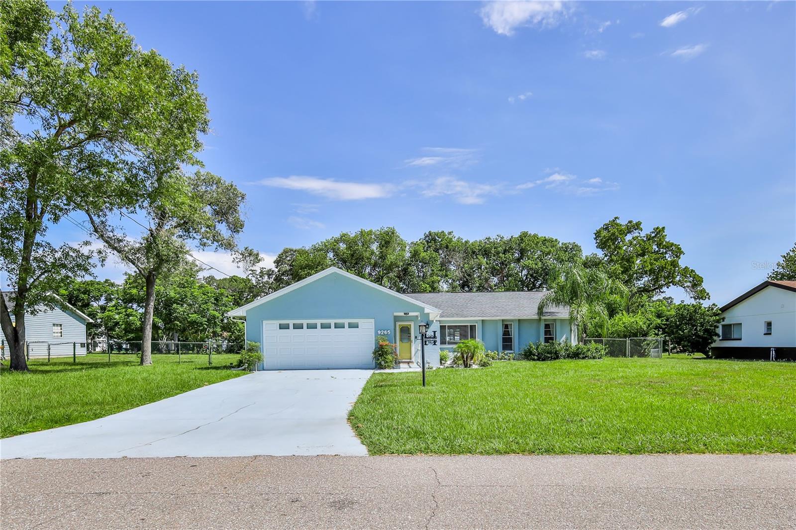 This remarkable residence encompasses numerous desirable features. It is situated on half acre Mol, completely enclosed with a chain-link fence for your animals, complimented by a vinyl privacy fence surrounding the in-ground, saltwater pool which accompanied by a beautiful pergola for shaded relaxation. The pool heater is 2 years old, and the pump has recently been installed. low maintenance AstroTurf encircles the pool area (, no weeding). Additional amenities include 4 seasons room /Lania, outdoor Security cameras, a fire pit, and a detached 24x24 2 car garage/ workshop. The roof on the house and garage is 2021, A/C is 2019, the electric panel was updated in 2021, the pool was installed in 2002. The residence boasts a recently renovated primary bathroom featuring beautiful quartz countertops with an abundance of surface space, as well as the new modernized tile shower. The kitchen has granite countertops and a separate dinette that overlooks the pool. in addition, there is a breakfast bar and a large dining room off the kitchen. There is a spacious bonus room or flex room that can be a bedroom. Located in a highly sought after neighborhood in the heart of Springhill. This property is priced for a quick sale. Do not hesitate on this unique Home.