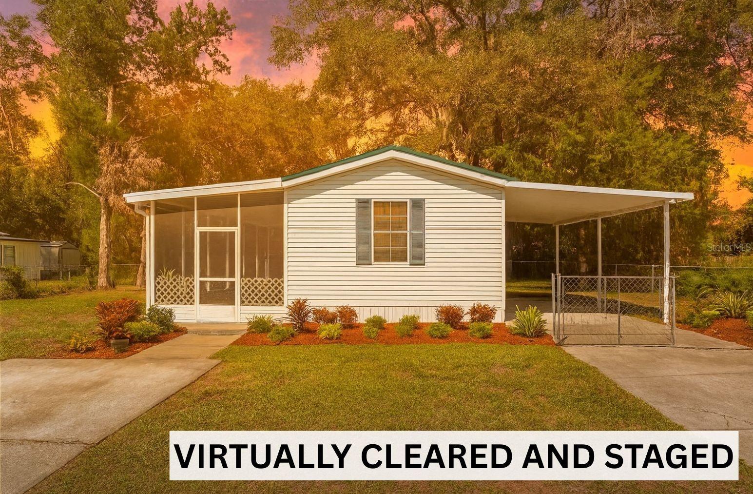 Welcome home to this well-kept 2 bedroom, 2 bathroom manufactured home offering just over 1,000 sq ft of comfortable living space.
This 1996 home has been nicely maintained over the years and is ready for its next chapter. Step inside to find brand new hardwood floors in the main living area, a brand new dishwasher, and newer appliances. The kitchen features uniquely designed glass cabinets with plenty of storage, while the laundry room offers even more cabinet space plus washer/dryer hookups.
Both bedrooms include built-in closets, and the bathrooms feature a double vanity and wood flooring. Outside, you’ll love the brand new screened porch and new front deck—perfect for relaxing under the mature oak trees that provide plenty of shade. The yard is fully chain-link fenced and includes a carport for covered parking.
The roof was redone about eight years ago, and the AC is in good working condition. This home has been fully inspected, providing added peace of mind and security for the new buyer.
Whether you’re looking for a first home, a vacation getaway, or a great rental opportunity, this property has endless potential and plenty of charm.