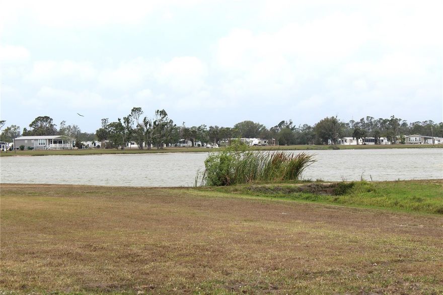 Another chance to OWN A PIECE OF PARADISE!  This WATERFRONT LOT is located in the sought-after Village of Holiday Lake.  The Village is  a WATERFRONT COMMUNITY, with docks and its own boat ramp just minutes to open water, Charlotte Harbor and the Gulf of Mexico! This LIf you are a golfer you will enjoy some of the area's finest GOLF COURSES all within a couple of miles from home. The Village of Holiday Lake boasts 25+ boat slips, beautiful pool area with 2 pools and BBQ area. There is always something going on at the large recreation hall with full kitchen, craft room, fitness center, laundry facility along with areas for woodworking, tennis, pickleball, shuffleboard and more. Golf Carts welcome. The outdoor enthusiast in you will love the closeness of boating and fishing from the community docks and boat ramp. You will also find several Gulf Shore Beaches close by. The foodie in you will love the local delights like Gerry’s Tiki Hut, TT’s Tiki on the Water and the Sandbar Tiki & Grill all of which can be accessed by boat or by car. The Village is perfect for year round living or a winter get away spot.