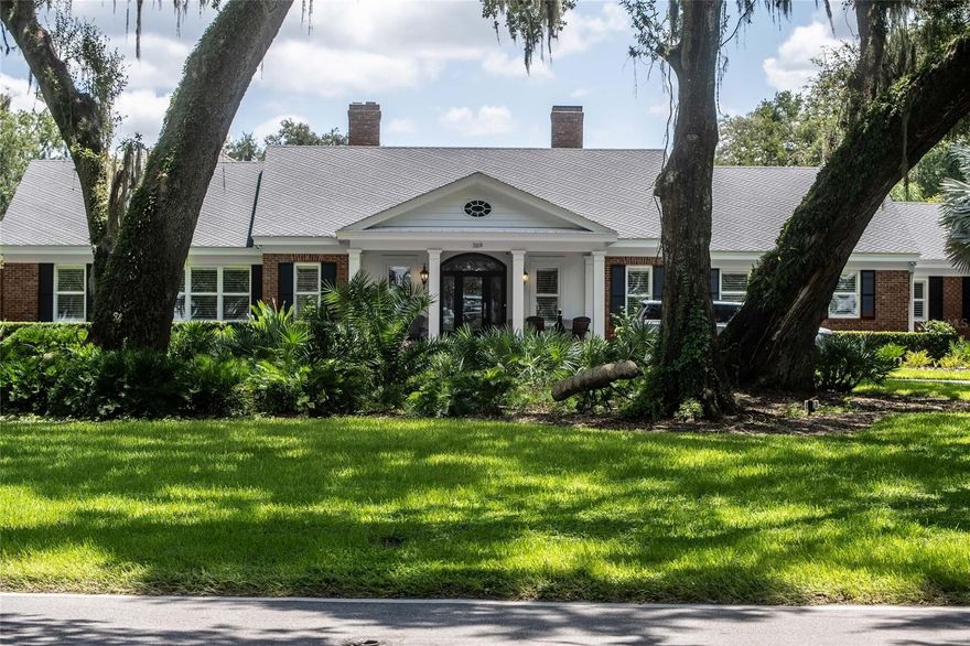 Exceptional Lake Hollingworth Estate!!! Located on one of Lakeland’s most iconic and sought-after streets with unobstructed lake views from the front of the home and your own private dock, this property offers a rare opportunity to enjoy the best of Lake Hollingsworth living in both style and comfort.
 
The main residence features 3 or 4 spacious bedrooms, 4 full bathrooms, 2 half baths, an office, formal living and dining rooms, a game room and a media room, all thoughtfully designed to blend everyday functionality with stunning finishes. Inside, you'll find hardwood floors throughout, lots of natural light, magnificent trim work, and spacious living spaces.  The primary suite is a private retreat, complete with built in cabinetry.  The primary bathroom suite boasts a walk-in shower and soaking tub in addition his and hers toilets, sinks, vanities, and closets – offering the ultimate in privacy, functionality, and luxury.
 
Set on an almost 2 acre tree-lined lot, the outdoor area is a true showstopper with a resort-style heated pool and spa, perfect for entertaining or relaxing in your own private oasis. Just steps from the main house is a detached guest house/mother-in-law suite that was built in 2021 featuring a spectacular kitchen space, dining and living space in addition to 2 bedrooms, 1 bathroom, laundry room, and additional bonus rooms.  This guest or pool house creates additional living space that is perfect for short or long term guests, gatherings with family and friends, and so much more.  
 
This unbeatable location makes this home is a rare find that offers luxury, versatility, and direct access to one of Lakeland’s most beloved landmarks. Don’t miss the chance to make 369 Lake Hollingsworth Drive your forever home.