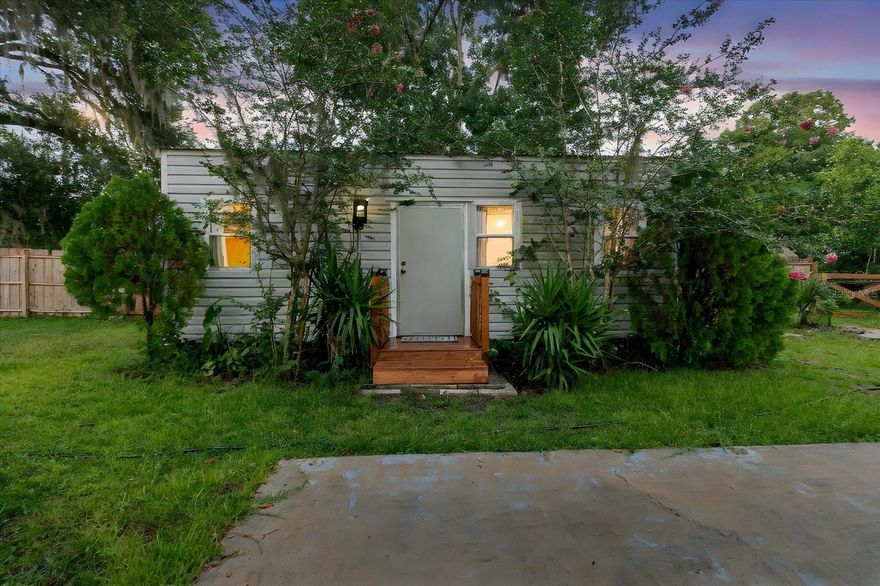 Welcome to this charming, move-in-ready cottage tucked just off E Gulf to Lake Highway, offering an ideal blend of privacy, convenience, and Florida lifestyle living. Surrounded by mature trees and a fully fenced yard, this cozy home sits on a generous lot with room to entertain, garden, or expand.

Step inside to an inviting layout featuring warm natural light and comfortable living spaces perfect for a  downsizer, or anyone looking for an affordable, centrally located home. Outside, enjoy a spacious lawn, established landscaping, and a beautiful custom wood deck complete with seating—an ideal place for morning coffee, weekend gatherings, or unwinding under the shade of towering oaks.

A standout feature of this property is its prime location. The home offers quick access to stores, restaurants, parks, lakes, and nearby nature preserves. Aerial photos highlight just how close you are to everything, while still maintaining the quiet charm of a tucked-away neighborhood.

Whether you're seeking a low-maintenance home, a rental investment, or a property with future commercial potential (verify zoning), this one checks every box.