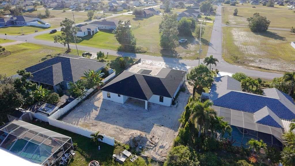 Enjoy this beautiful New Construction Home, with 4 bedrooms a pool, and 2 baths. The open floor plan makes this home very spacious, with its tile floors and stylish fixtures. Stainless steel appliances and quartz coountertops match seamlessly with the europen style cabinets. With a bathroom equipped with his-and-hers sinks, a walk-in shower and tub. This home is equipped with hurricane impact windows and doors.