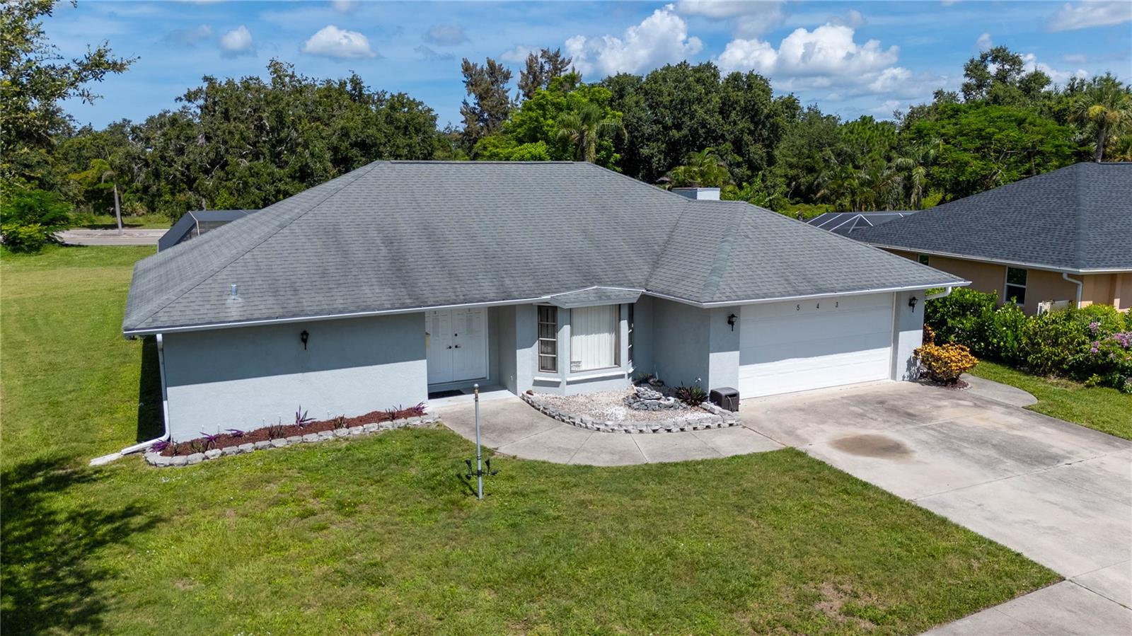 Situated on an oversized 0.42-acre lot, this spacious 3-bedroom, 2-bathroom pool home offers incredible value, flexibility, and potential. With 2,264 square feet of living space, this property features a private in-ground swimming pool, Mother-in-Law suite with its own kitchen with cooktop.
Generac Whole House LP Gas Generator, providing up to 2 weeks of power. This home is the perfect blend of comfort, function, and peace of mind. Built in 1991 and priced below market for a quick sale, the home is solid and well-maintained with great bones, offering buyers an amazing canvas for personalization. Roof was replaced in 2011, making it a smart investment with many major components already updated - NEW WATER HEATER 2025, NEW ELECTRICAL PANEL 2025, NEW AC WITH UV SYSTEM 2023, NEW POOL PUMP 2025, NEW WASHING MACHINE 2025.
Enjoy Florida living at its finest in the screened pool area, perfect for entertaining or relaxing. The two-car garage, generous driveway, and mature landscaping add curb appeal and functionality. The layout includes generous living and dining areas, a spacious kitchen, and a separate guest suite ideal for multi-generational living or potential rental income. Located just minutes from local shops, restaurants, golf courses, and top-rated schools, and only 15 minutes to Downtown Venice and the Gulf beaches, this home truly checks all the boxes for lifestyle and location. This is a great house, just needs a little TLC and cosmetic updating to make it shine. Don’t miss this incredible opportunity—schedule your private showing today before it's gone!